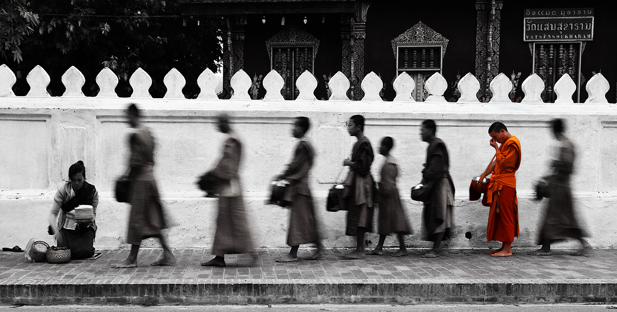 Monks collecting alms at dawn in Luang Prabang II