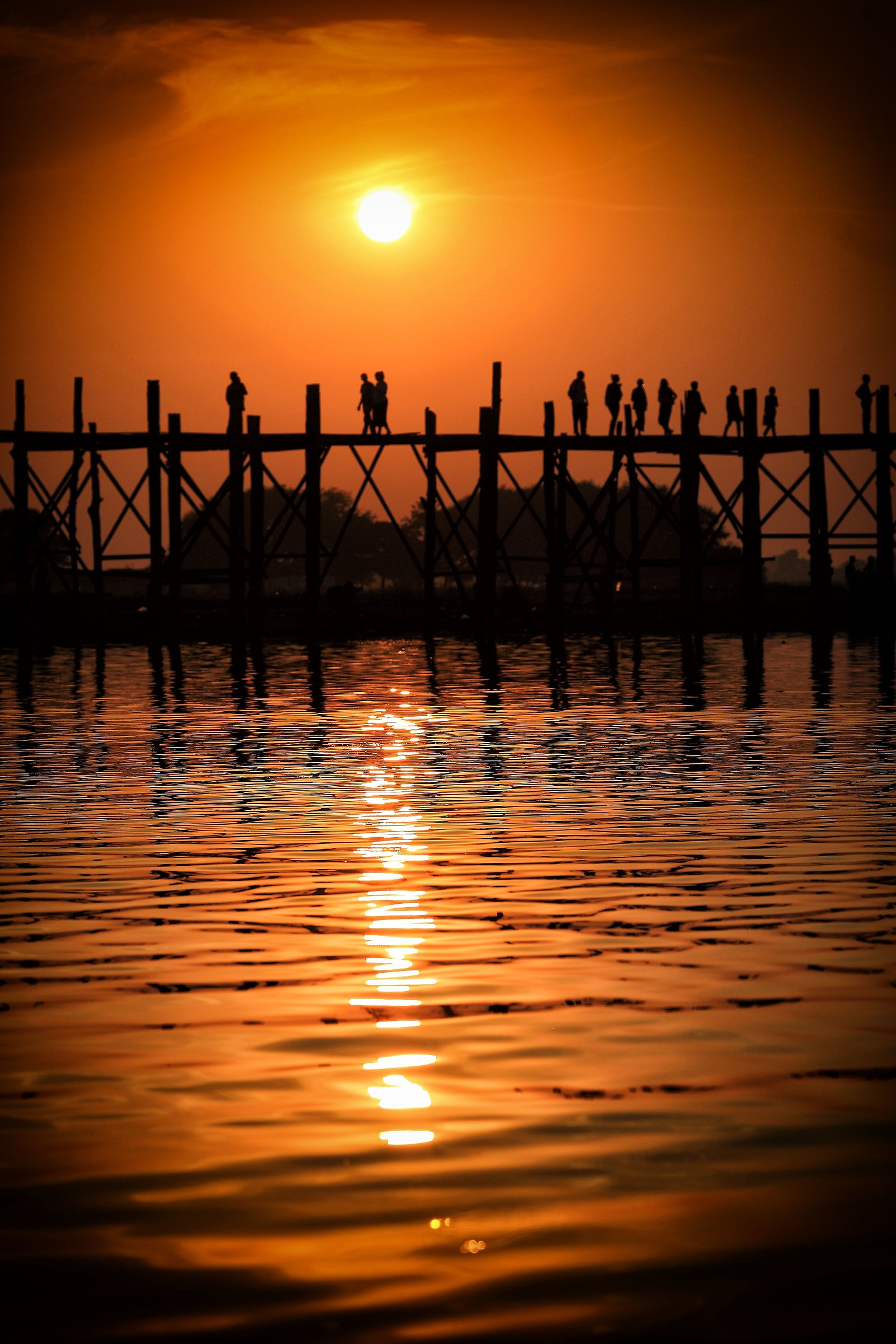 Myanmar - Life goes on U Bein Bridge at sunset