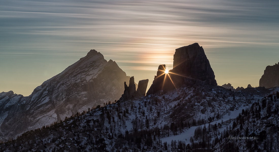 The sun rises in the middle of the Towers