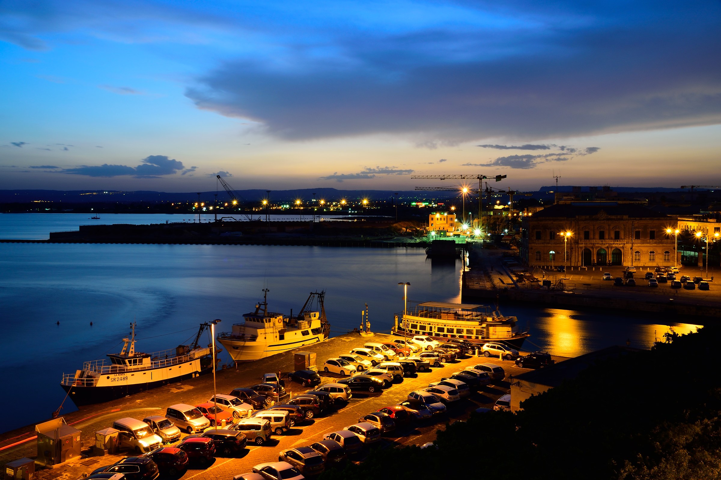 Sunset over the harbor in Ortigia.