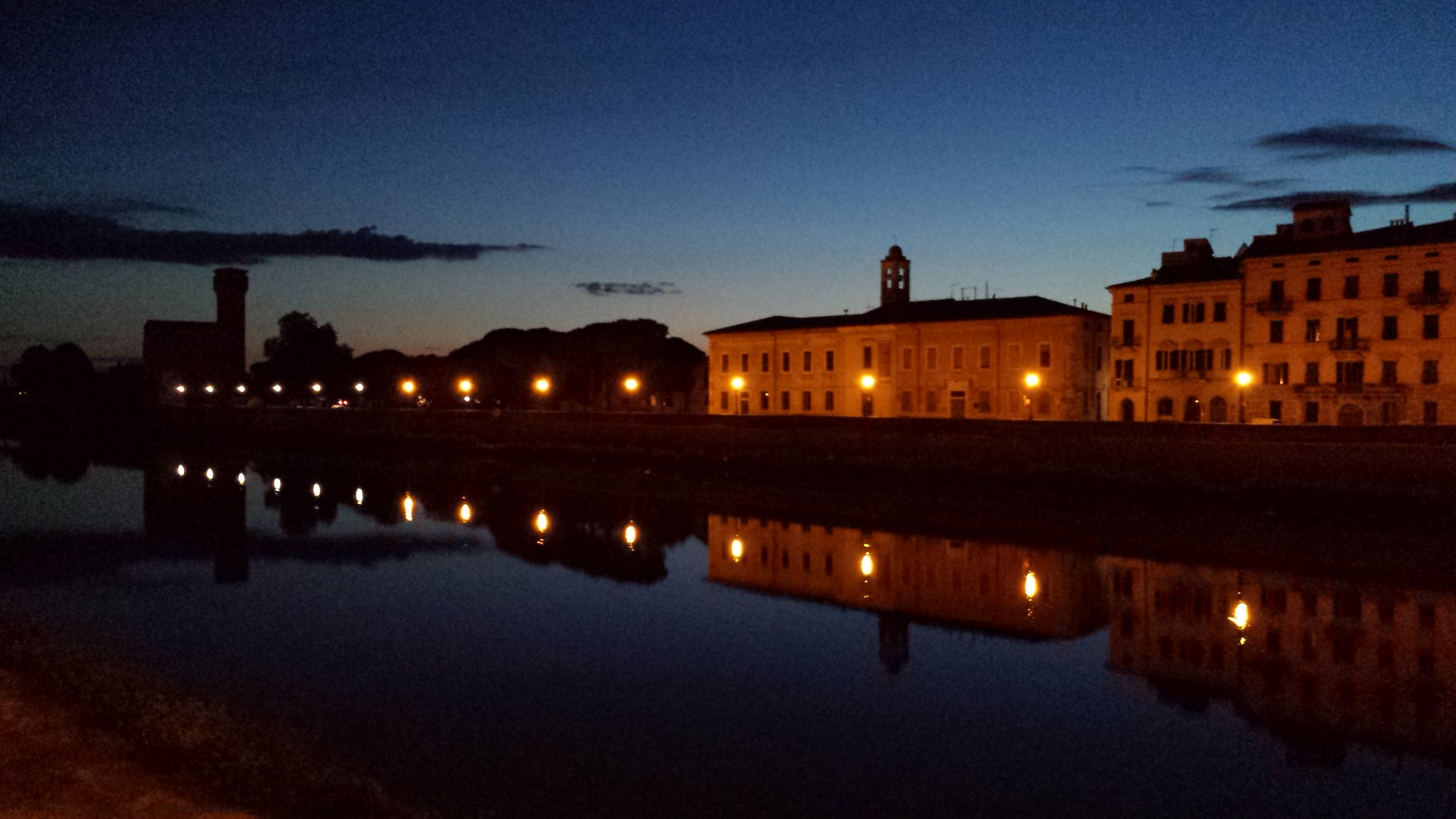 Sunset on the river bank in Pisa