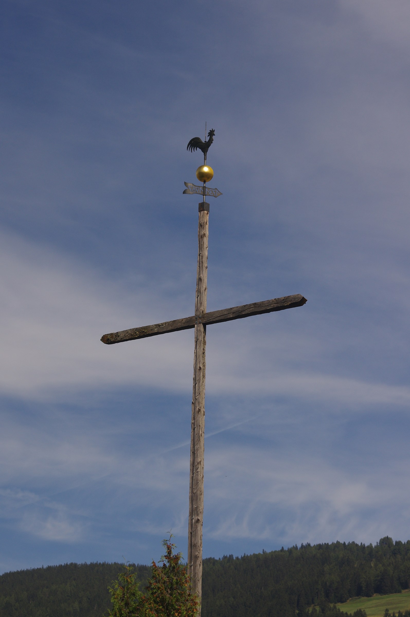 The rooster and the cross