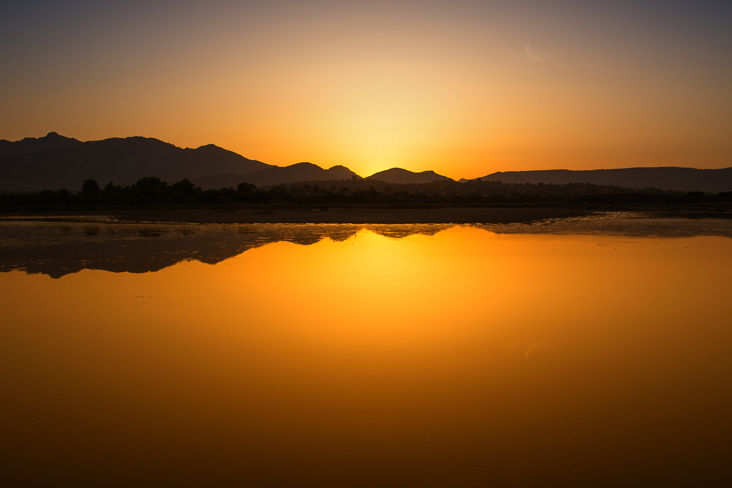 Beautiful sunset at the pond dell'Isuledda