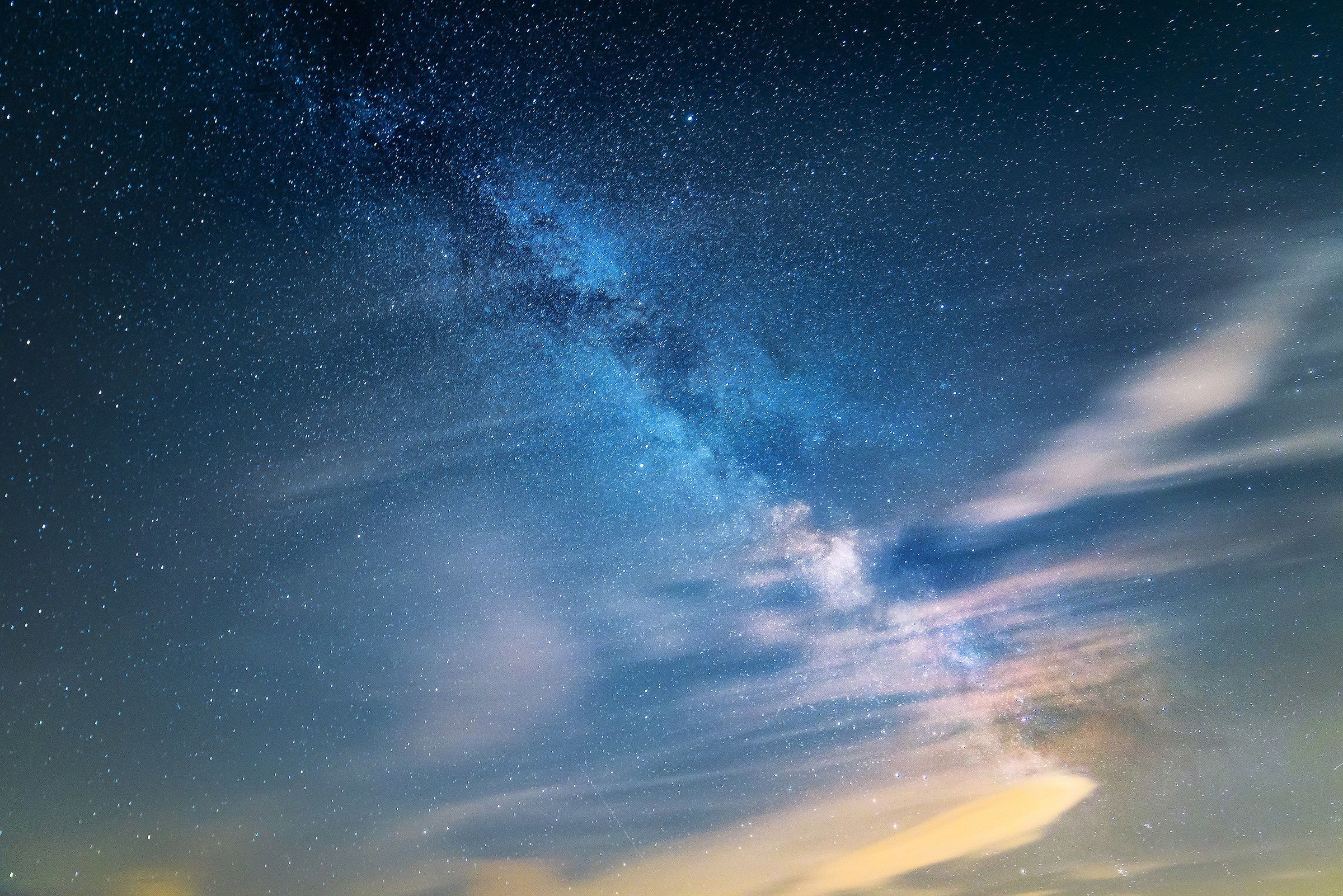a milky way with a clouds