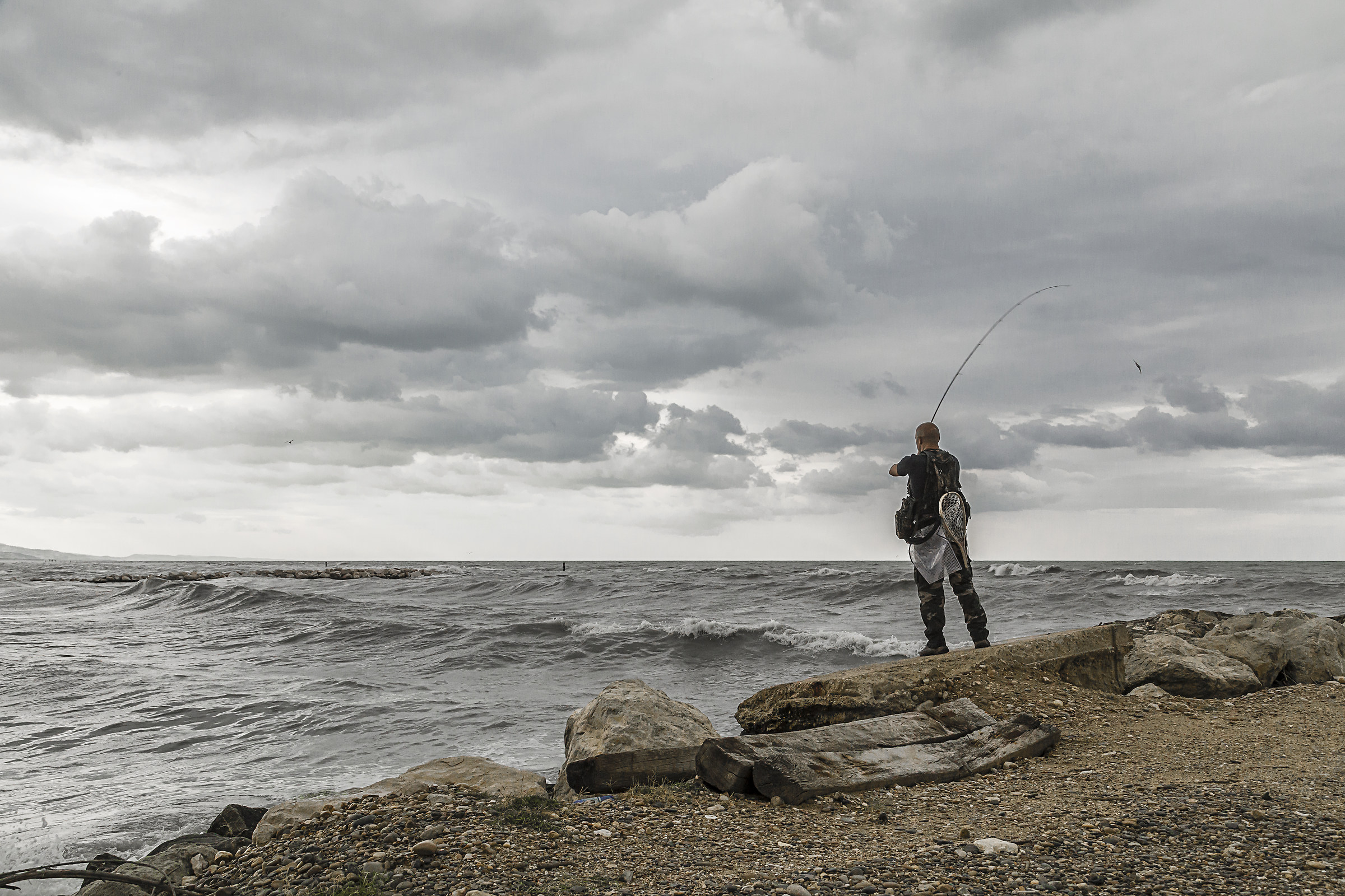 lone fisherman in Montesilvano (Italy)