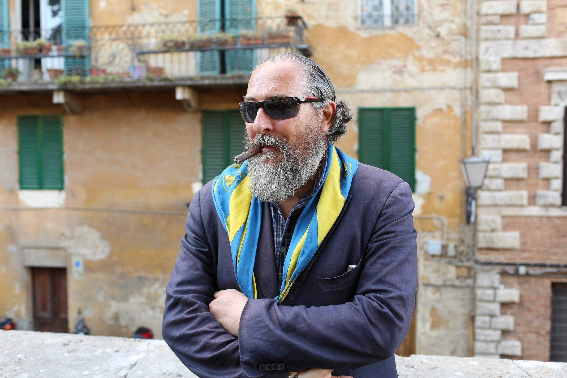 Portrait of man with beard and cigar