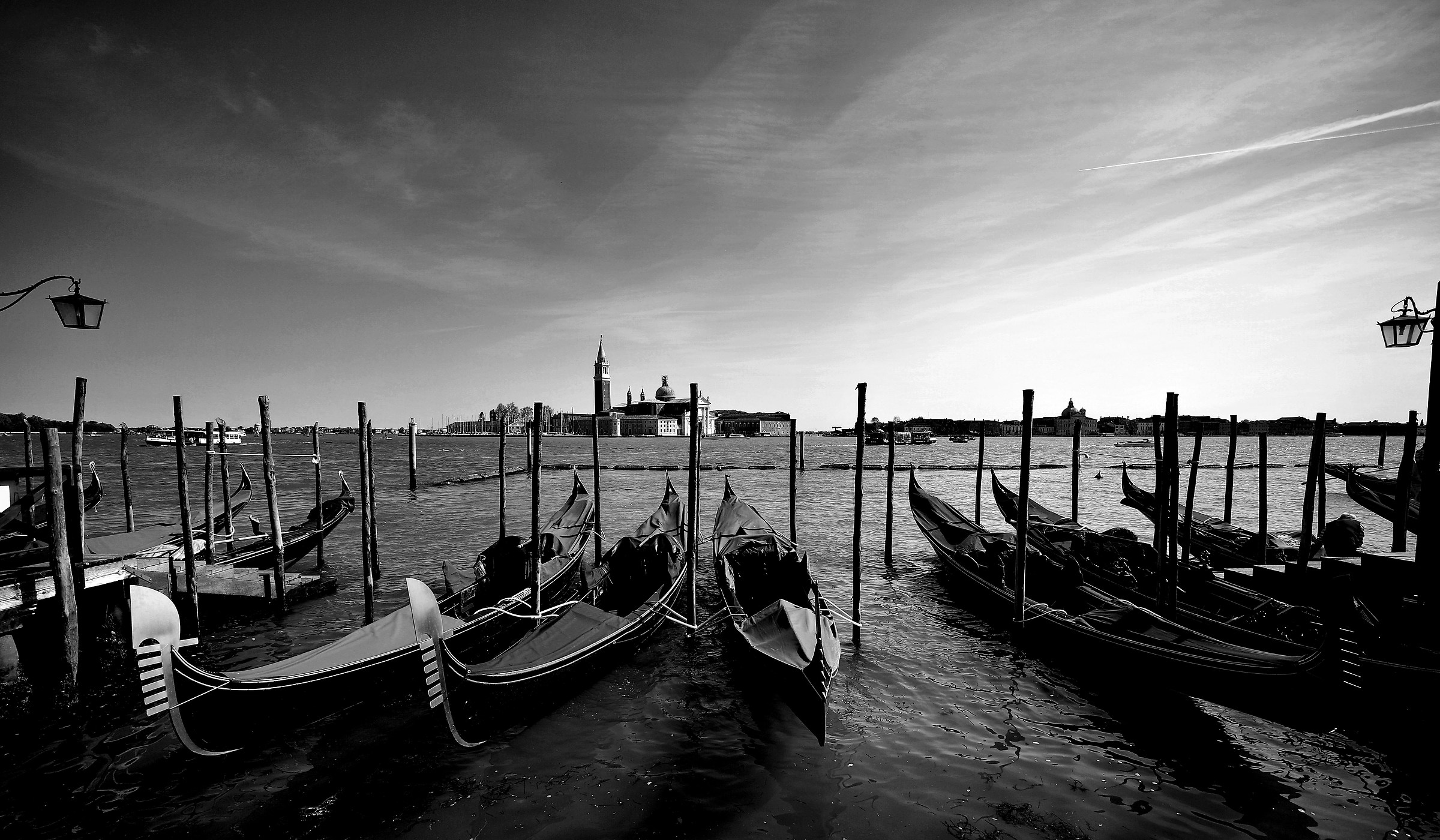 Between the two lampposts