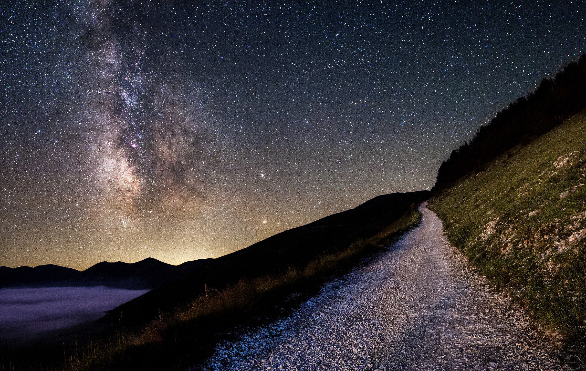 The dirt road leading towards the immense ..