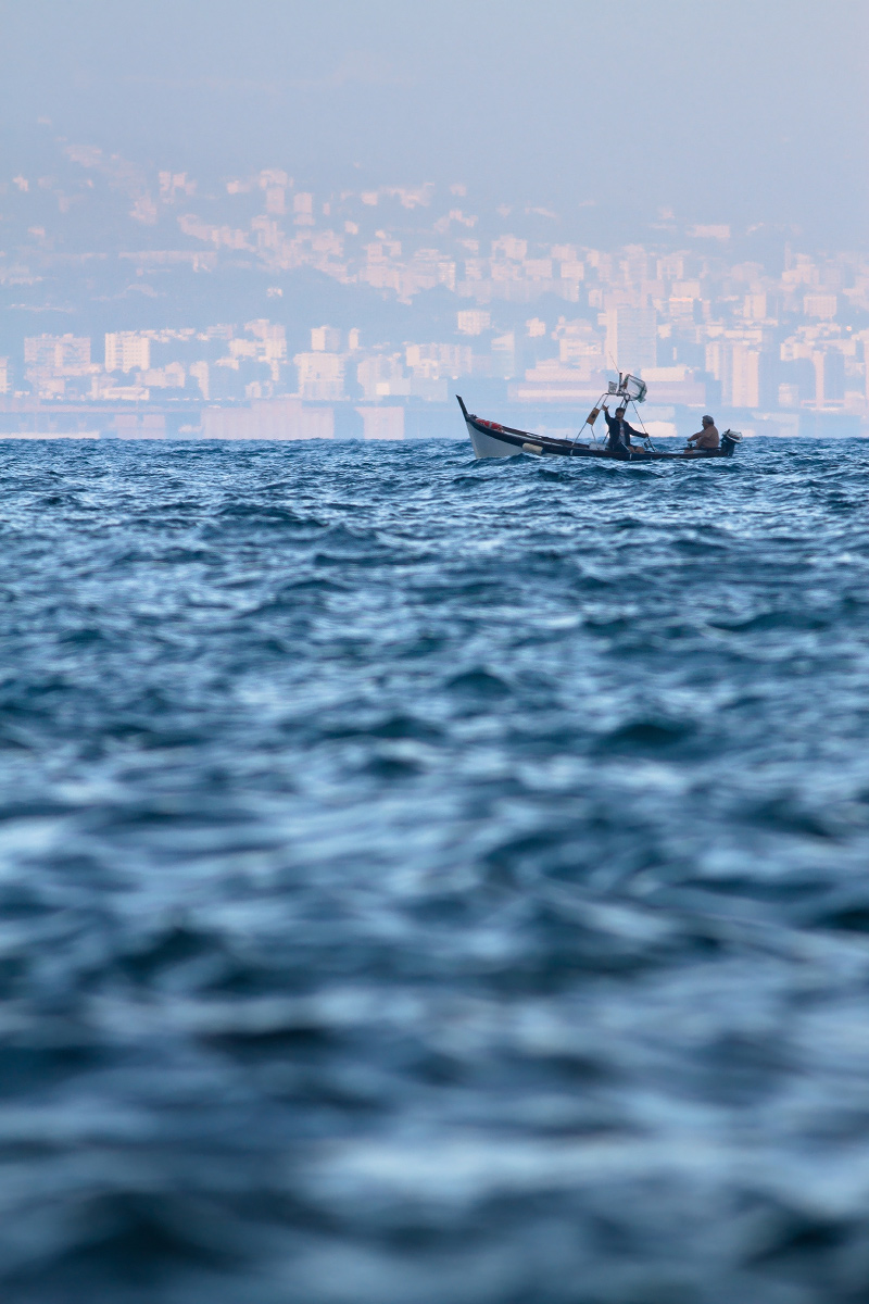 Fishermen in the evening - Genoa background