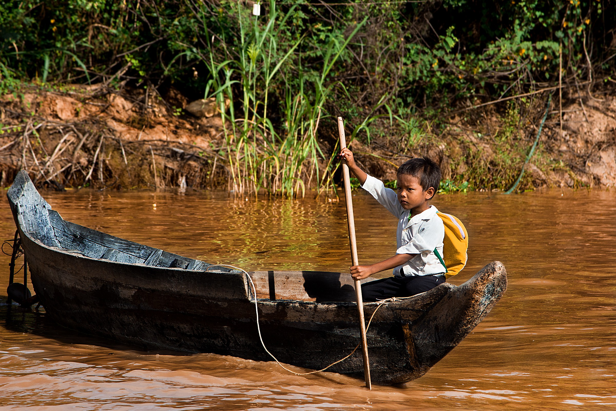 .. Not all children go to school by boat .. Cambodia.