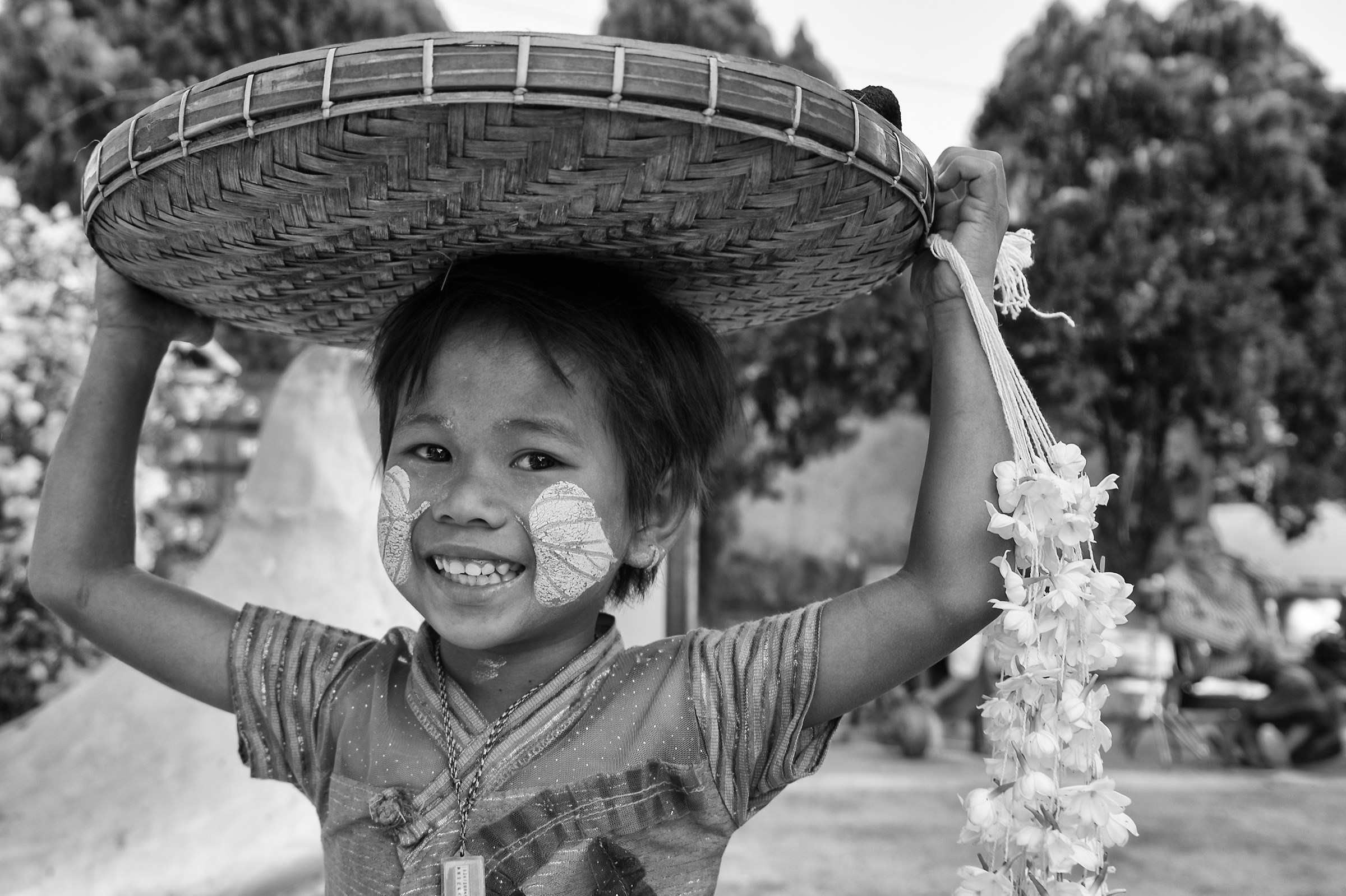 the small woman selling flowers
