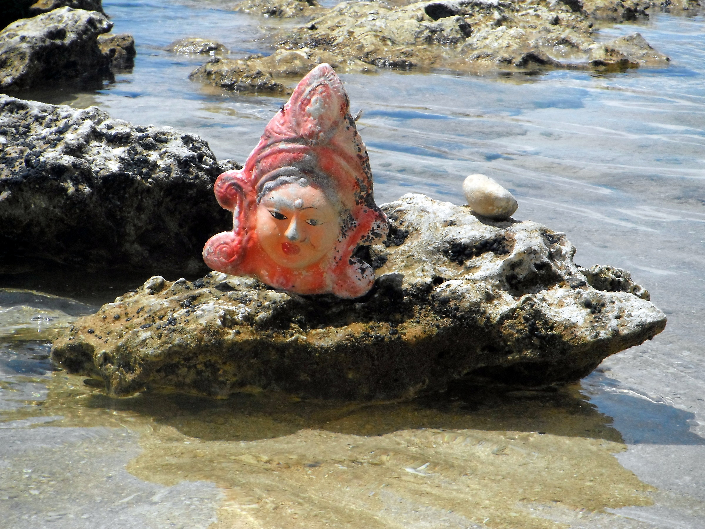 Statuette on the beach