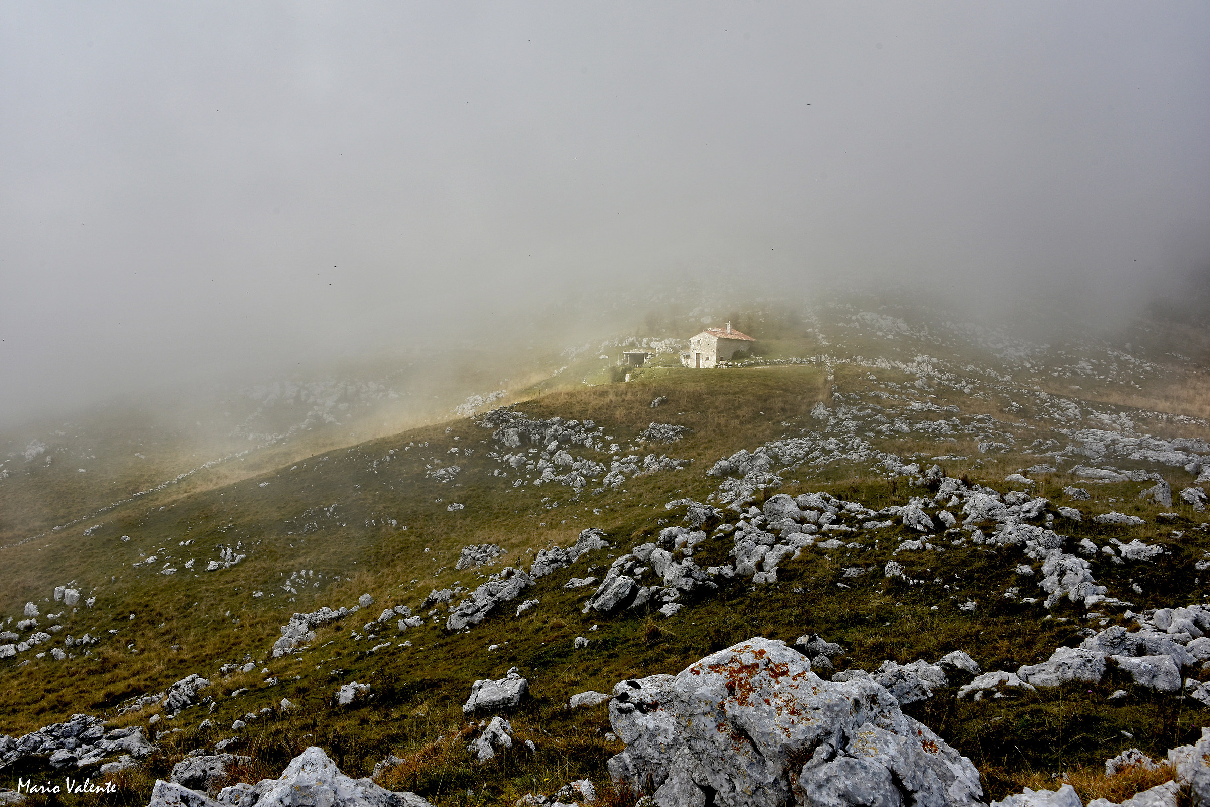 Farmhouse among the low clouds