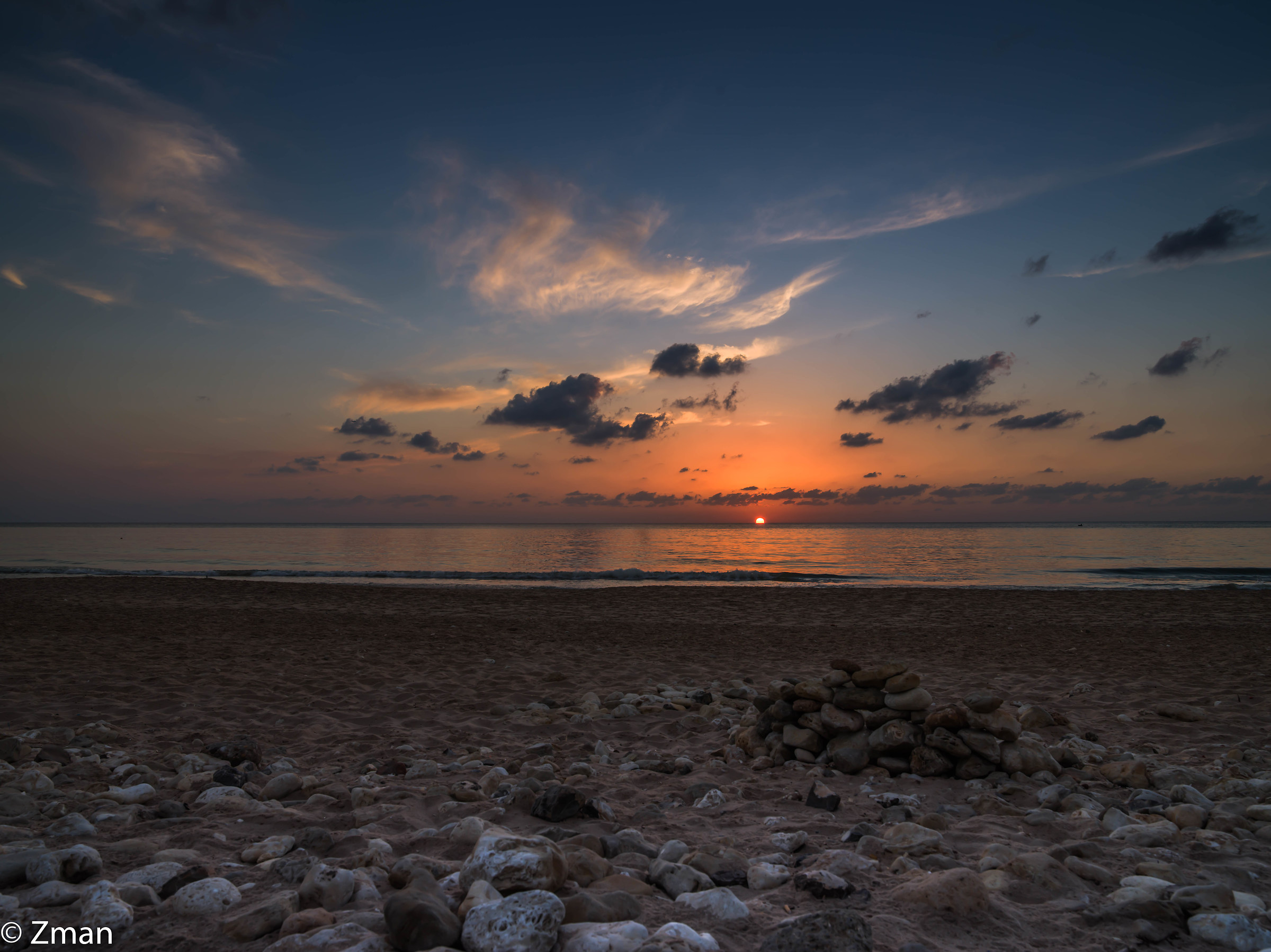 Pebbles sand and Sunset