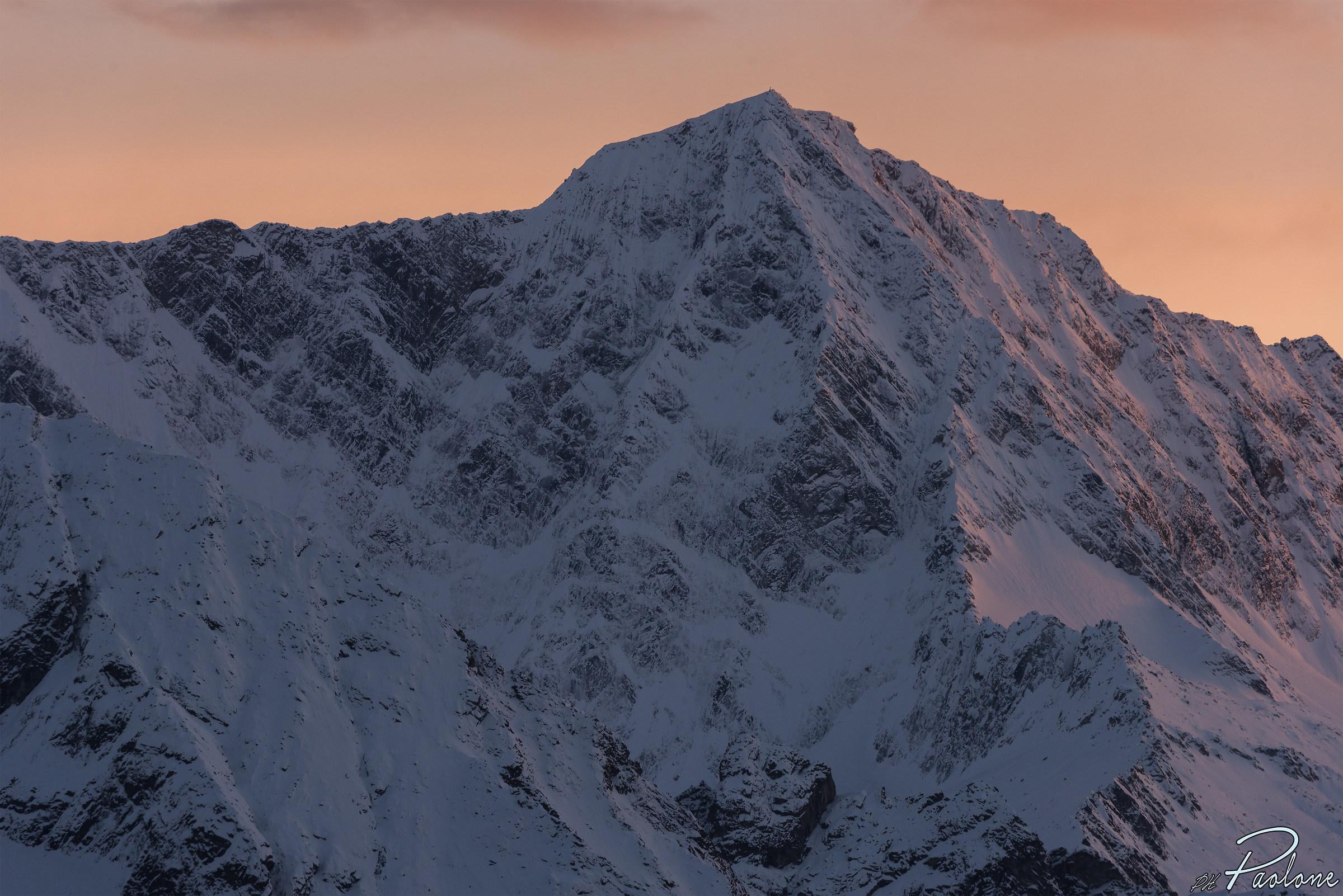 Adamello with rosé sky, the last rays of sun.