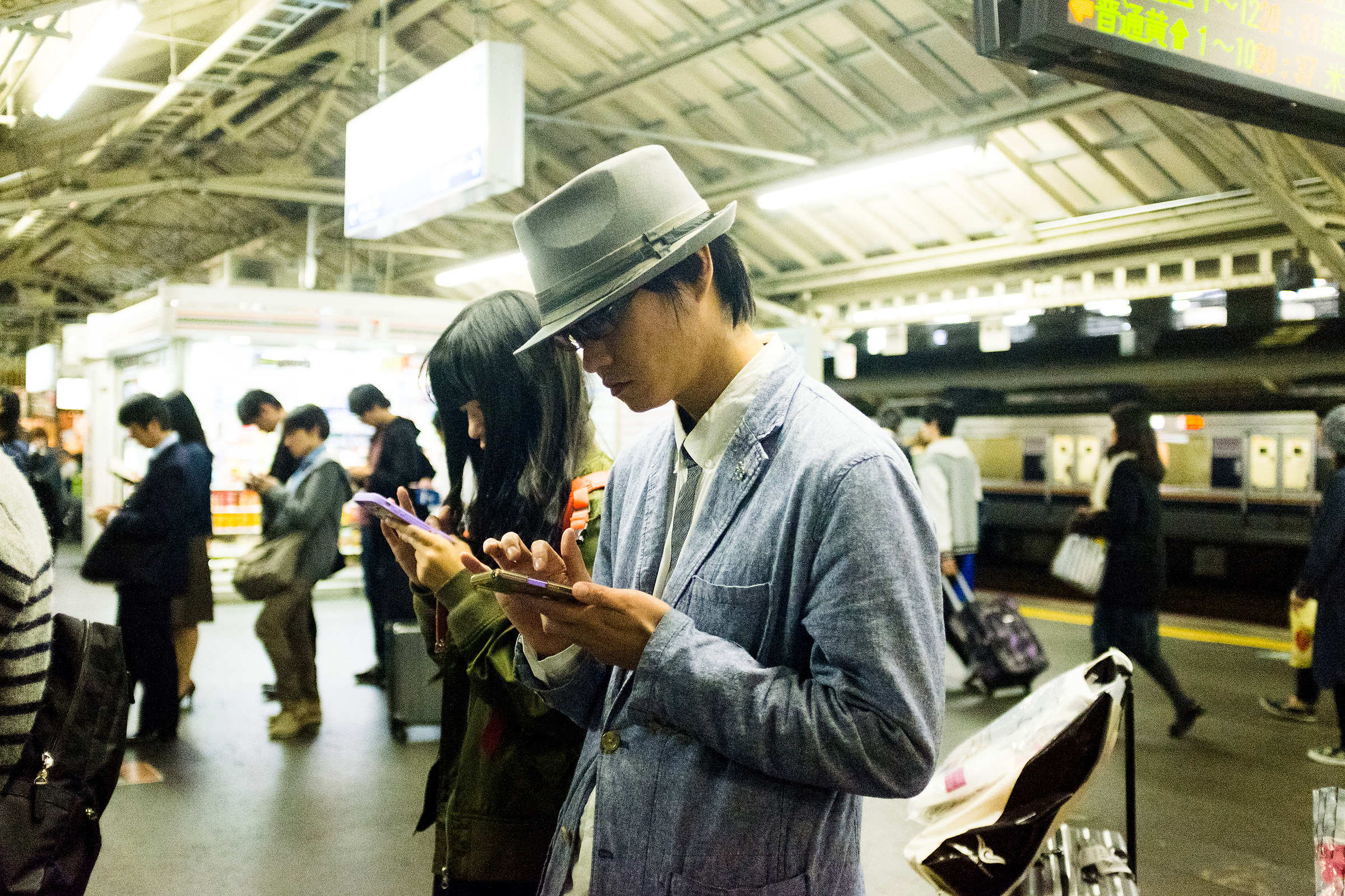Lined up waiting for the subway train.