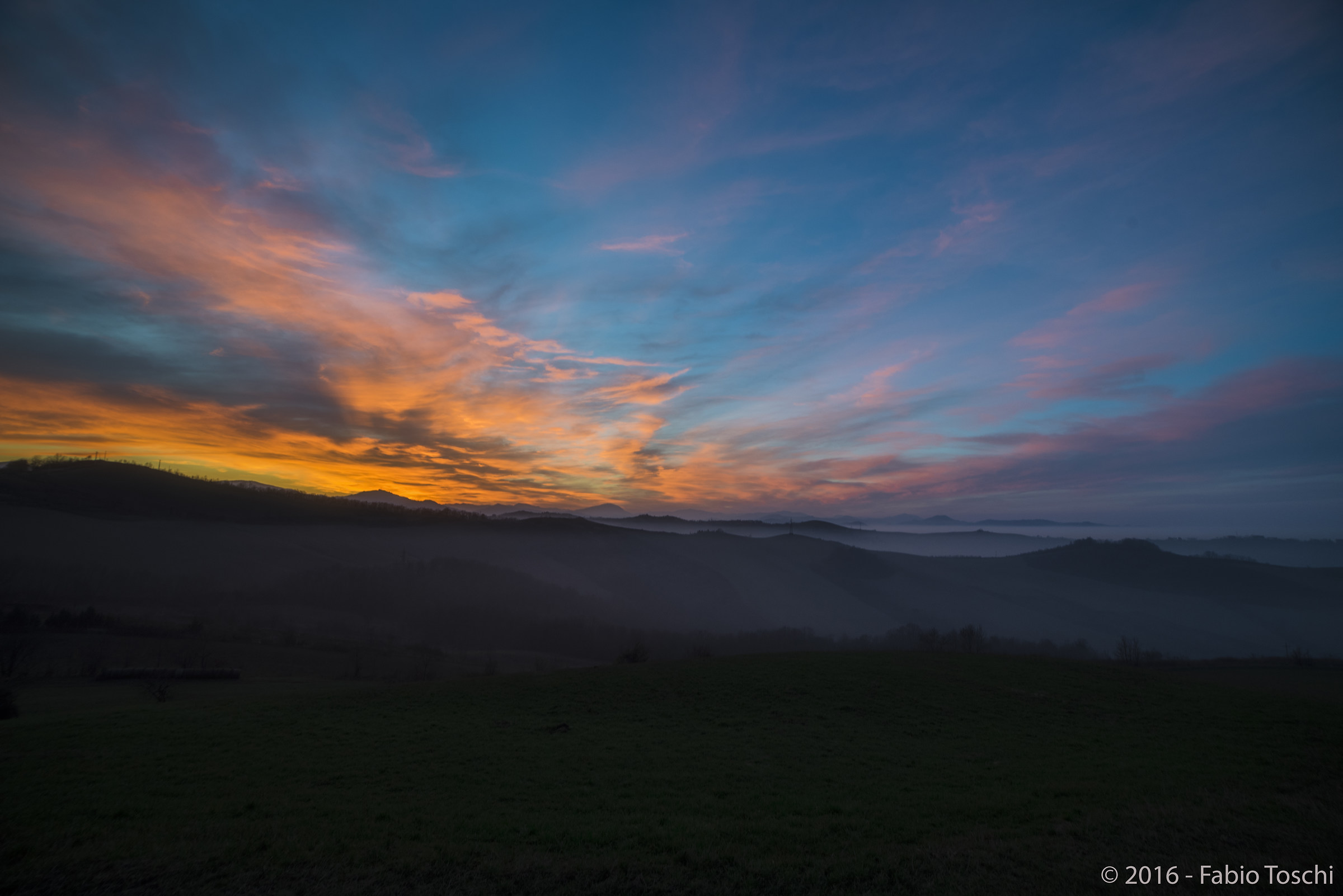 Sunset, hills and fog