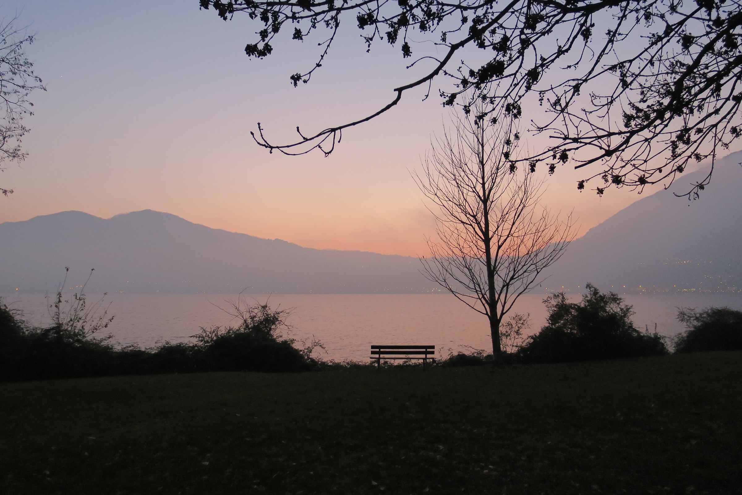 sunset on Lake Garlate veiled in mist
