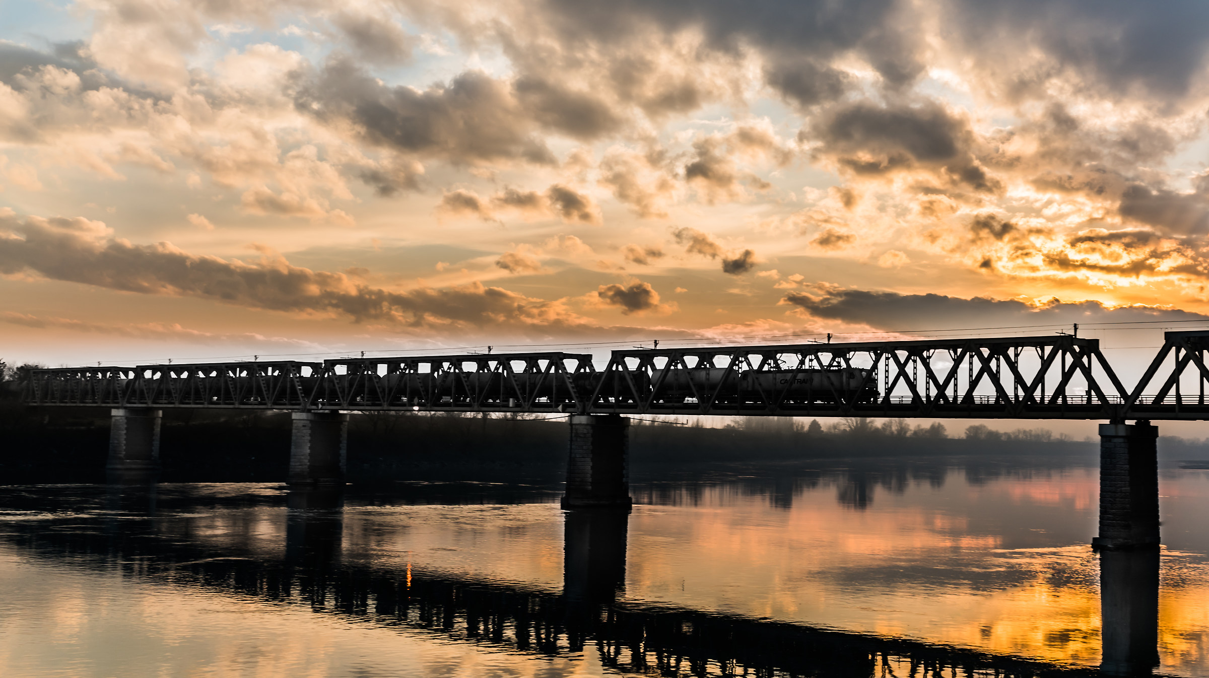 Moving train sunset in the running river in race