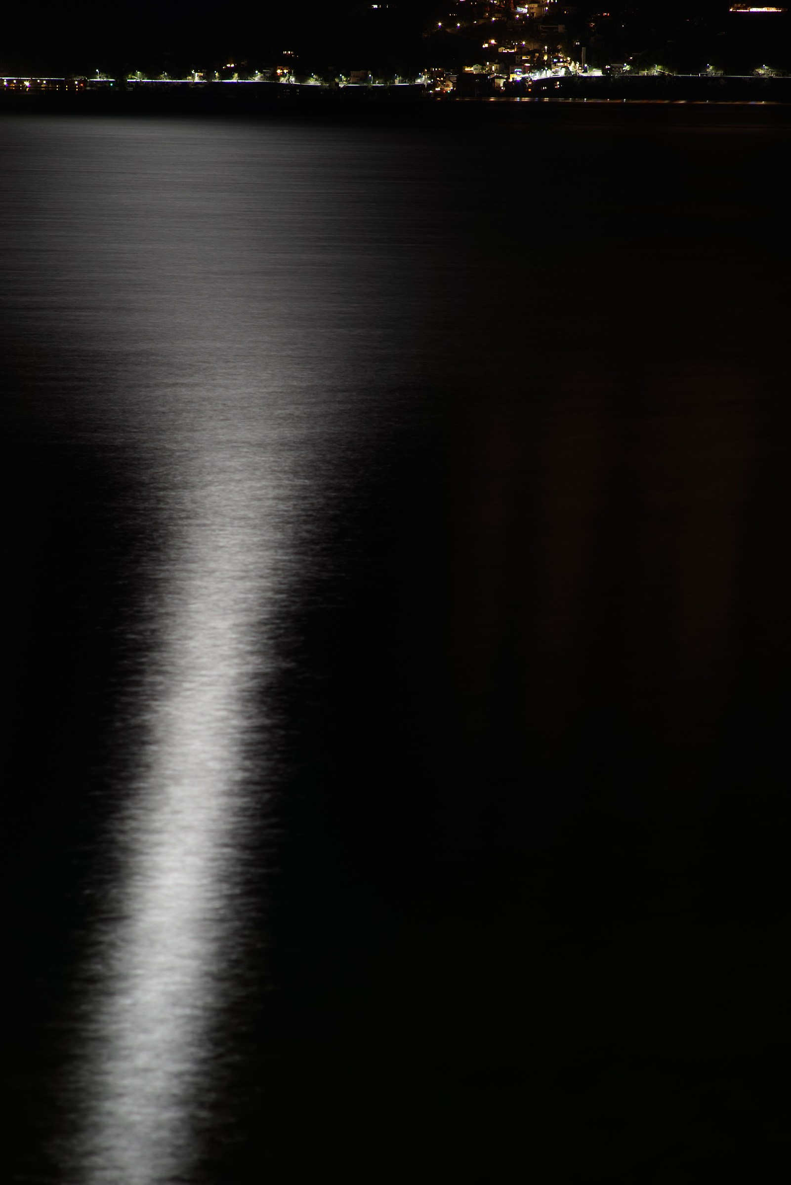 Reflection of the moon in Lake Maggiore