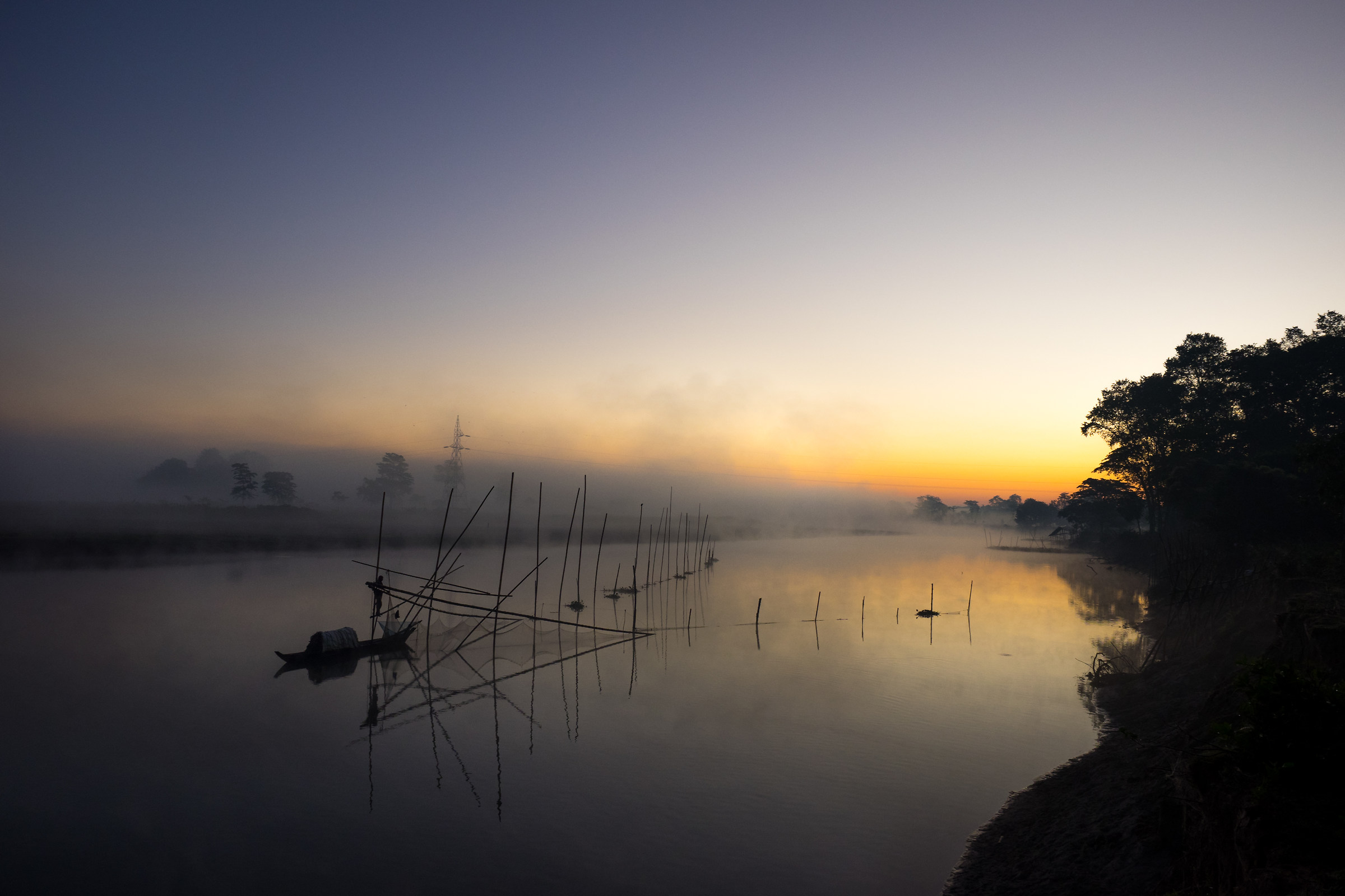 Sunrise. Fisherman island of Majuli, Assam. India.