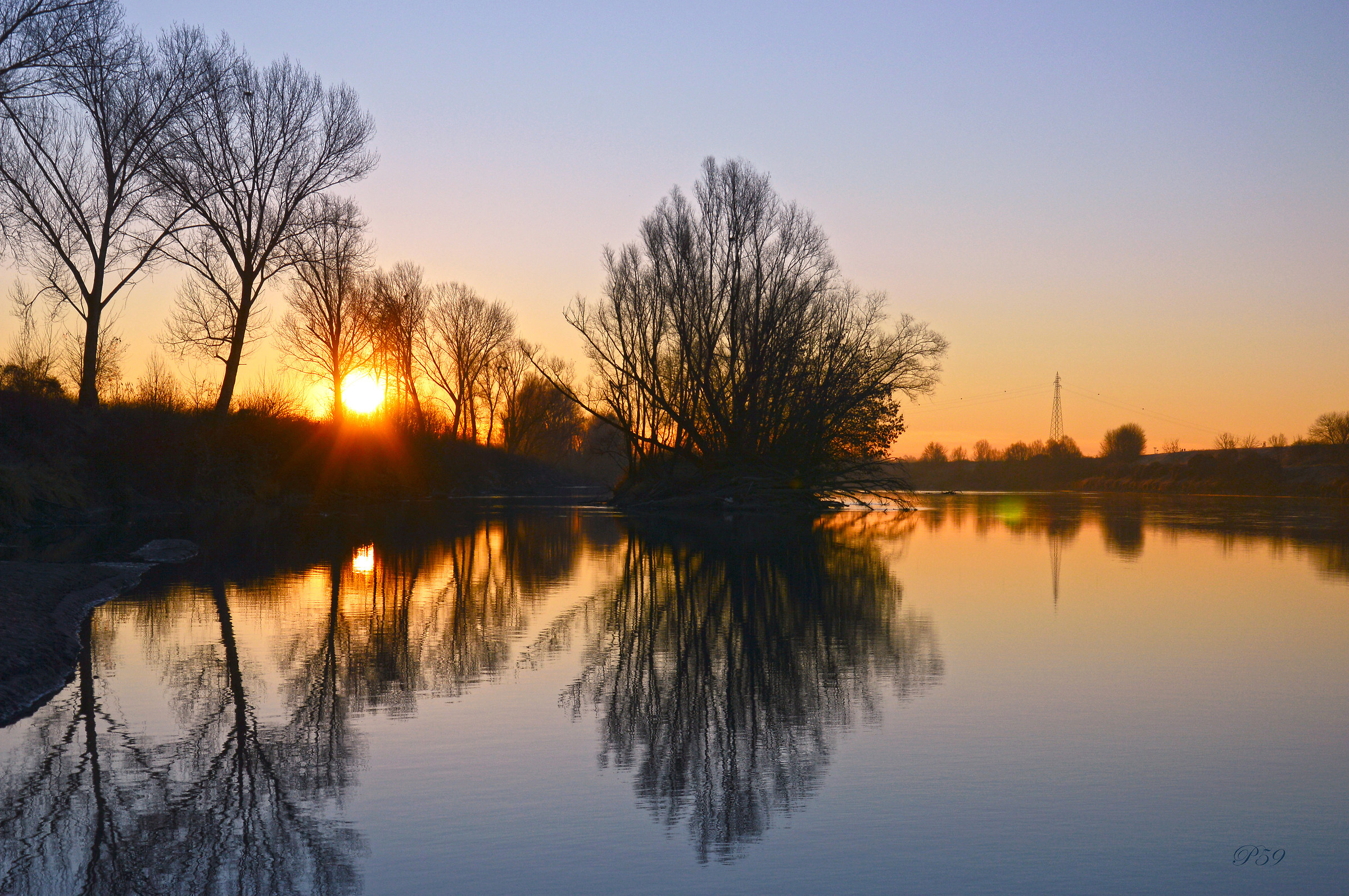 Il sorgere del sole sull'Adige