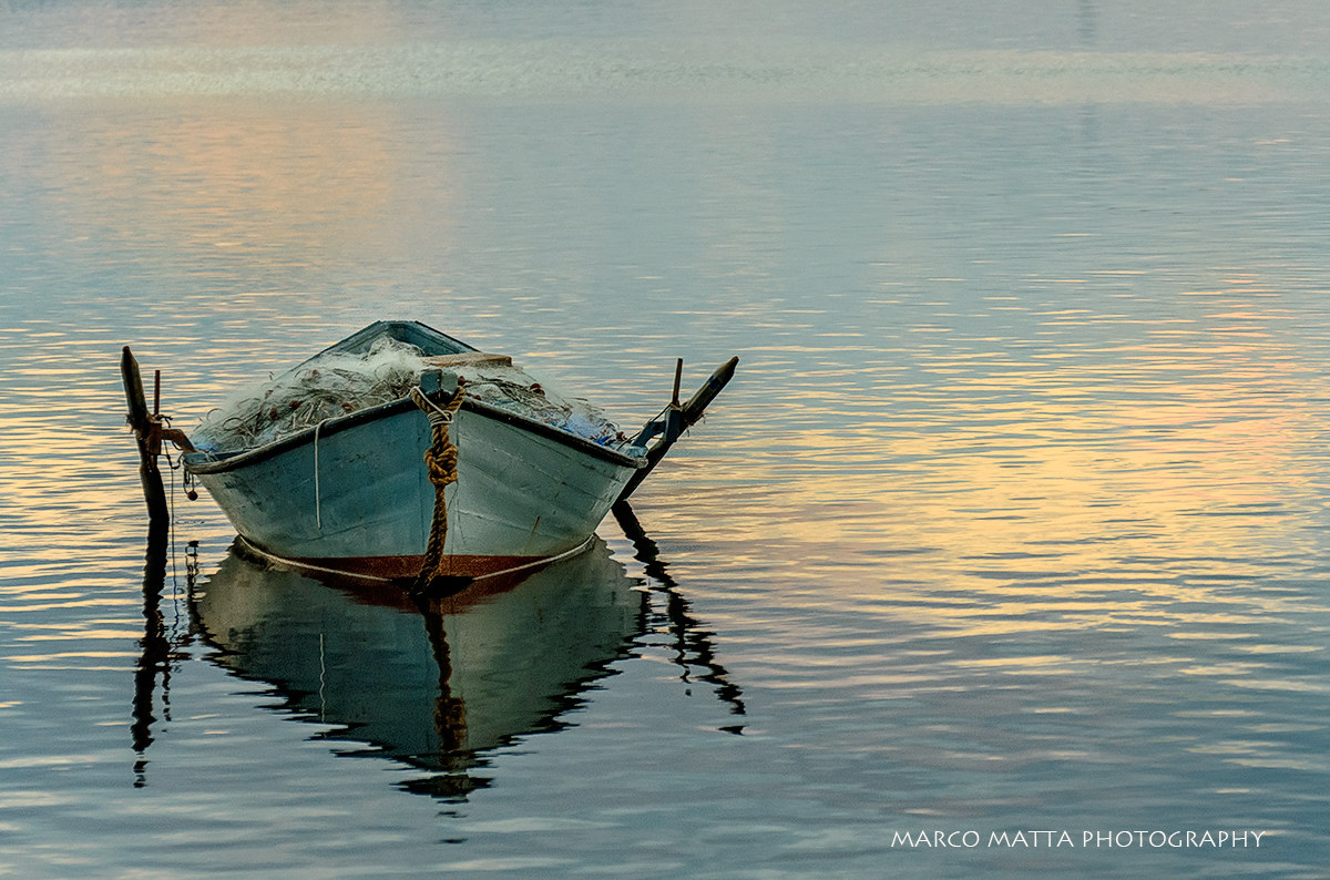 Boat in the lagoon at sunset