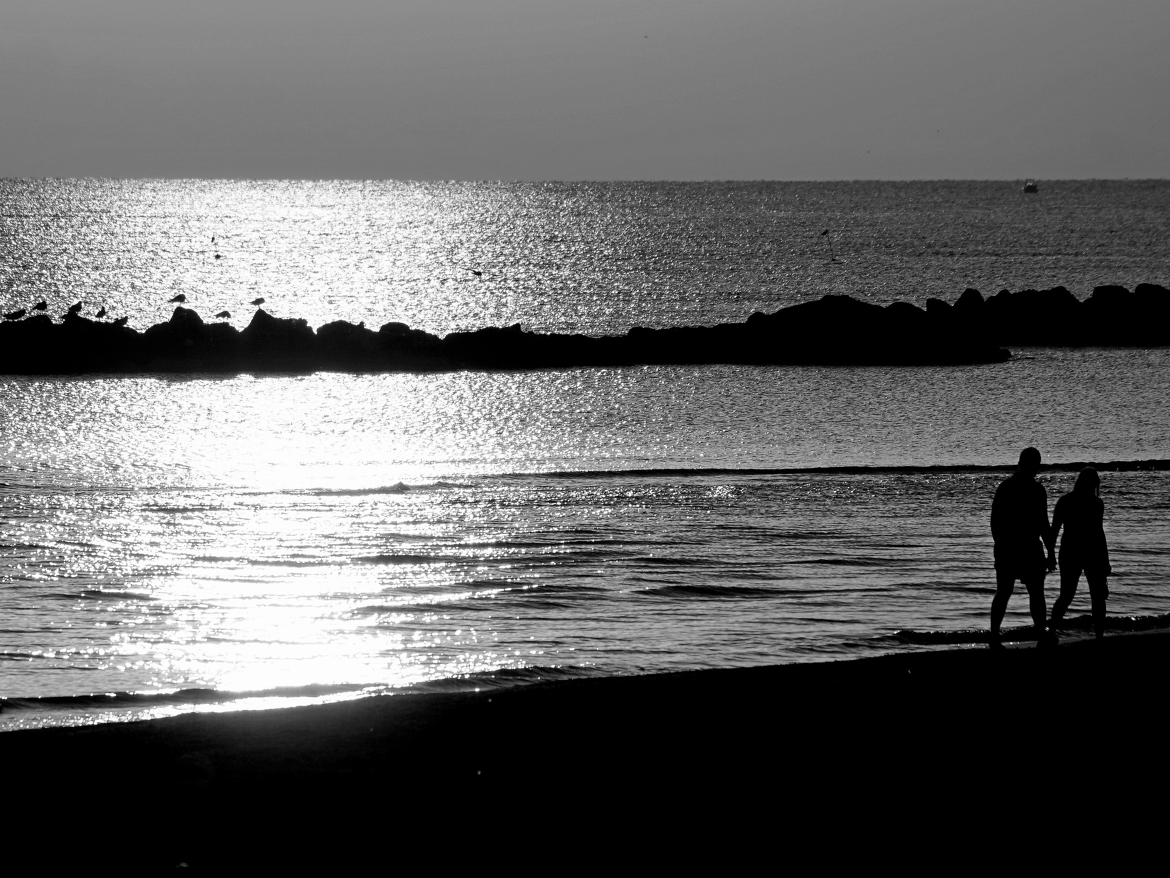 Two young lovers on the beach