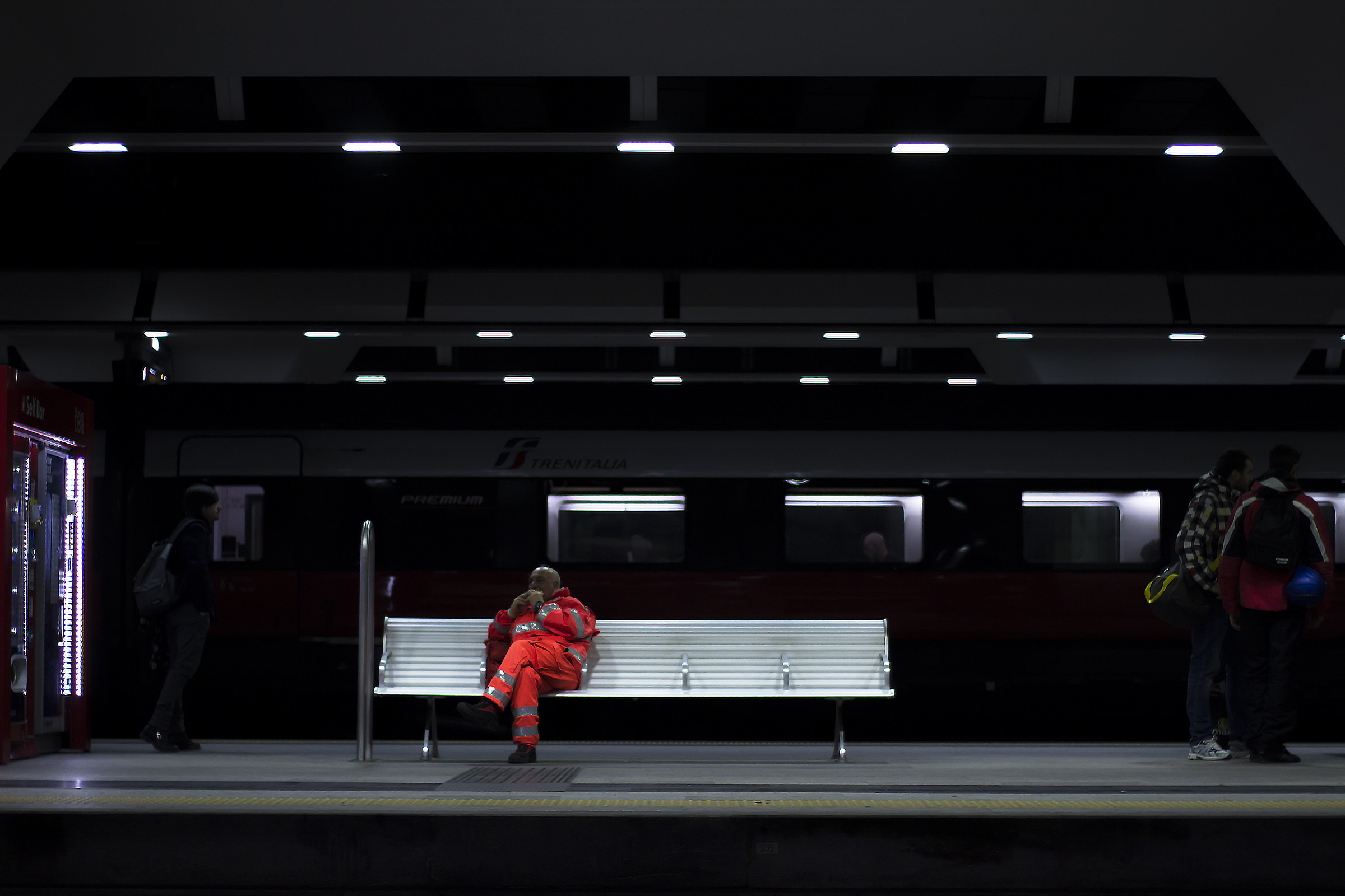The bench lit in the darkness of the station