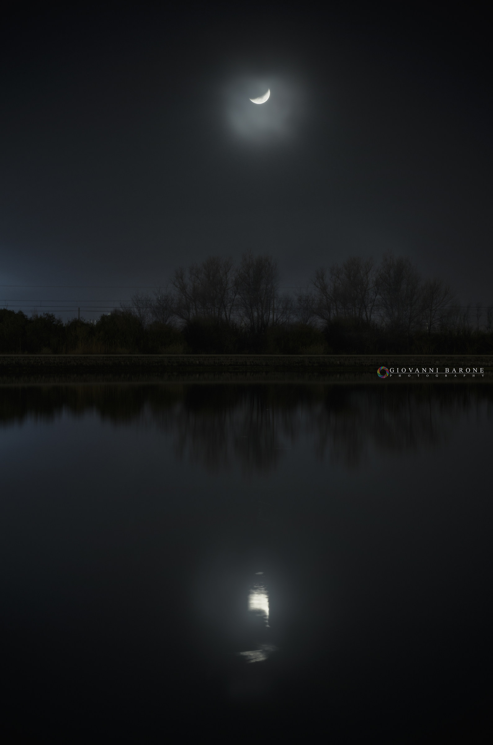 The moon reflected on the lake.