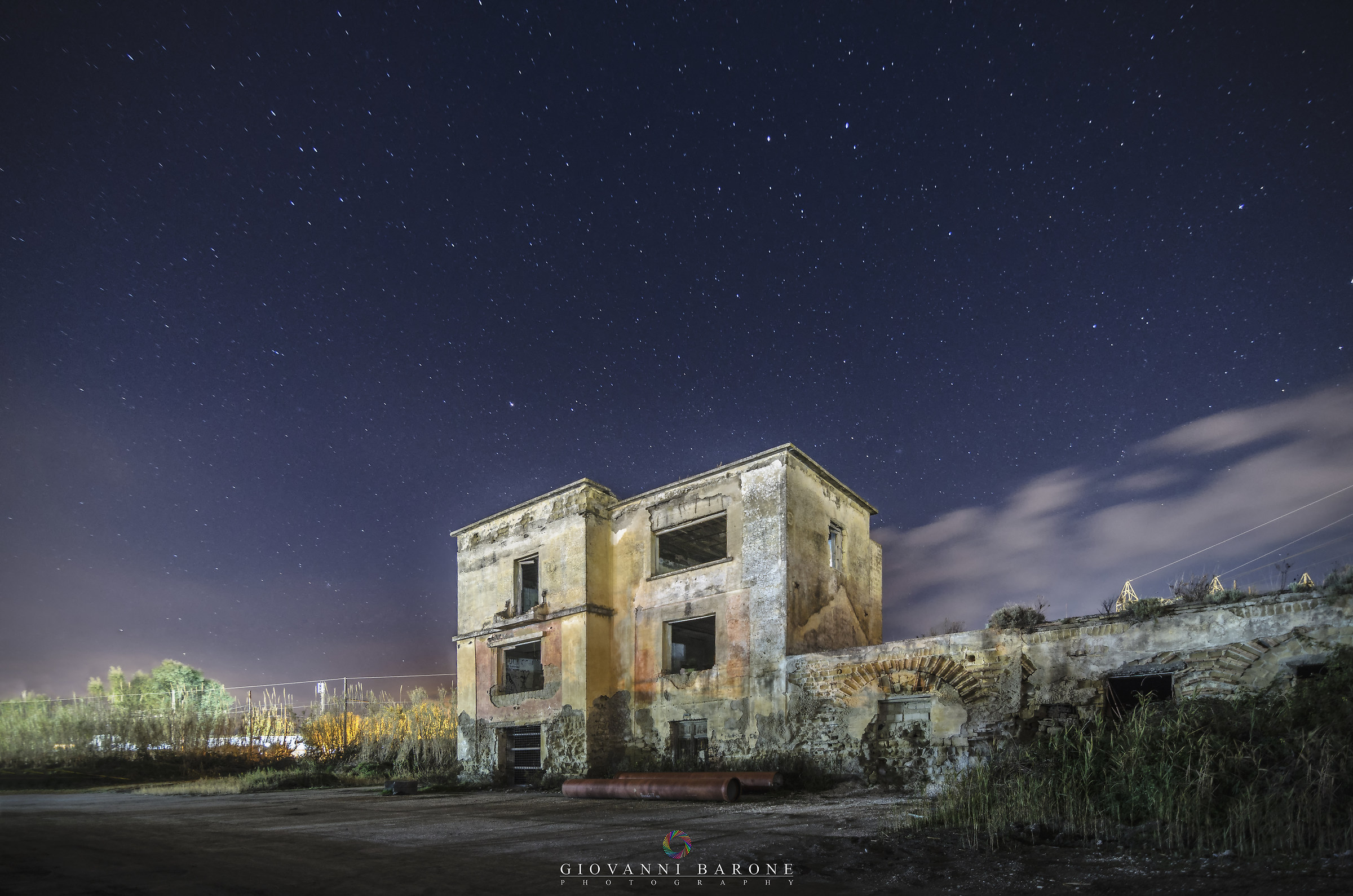 Abandoned structure on a starry night.