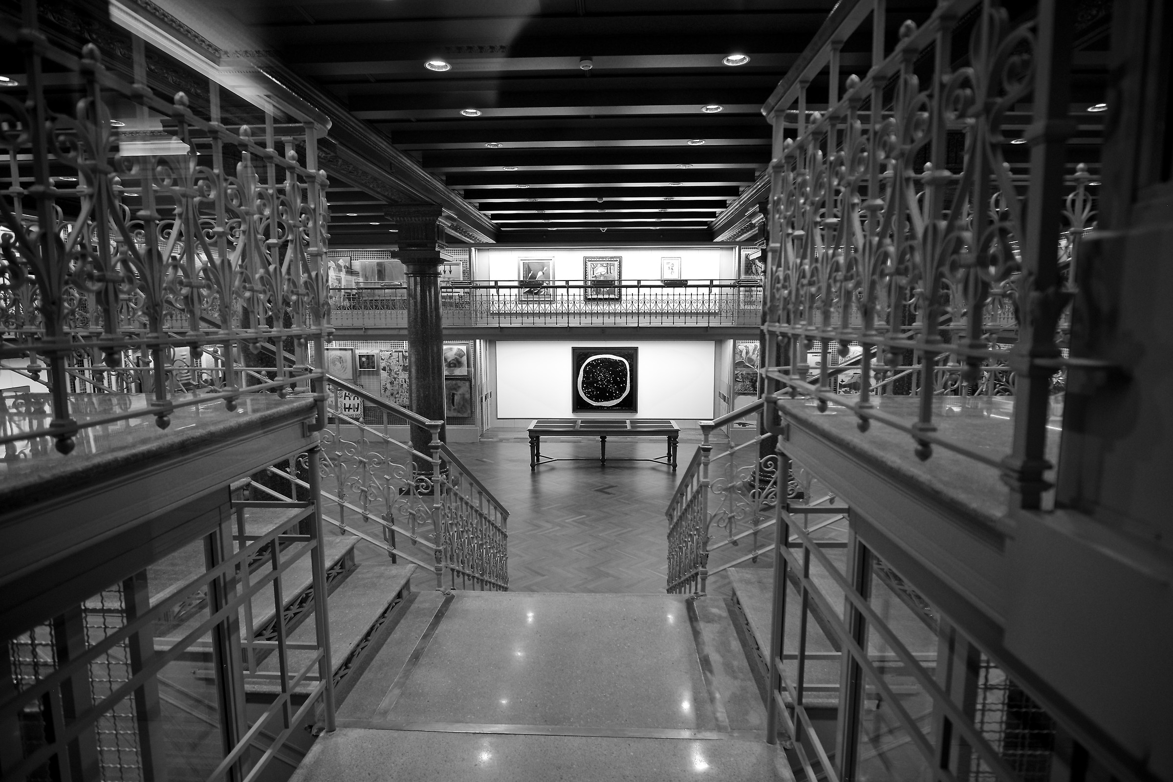 peering through the railings of Caveau