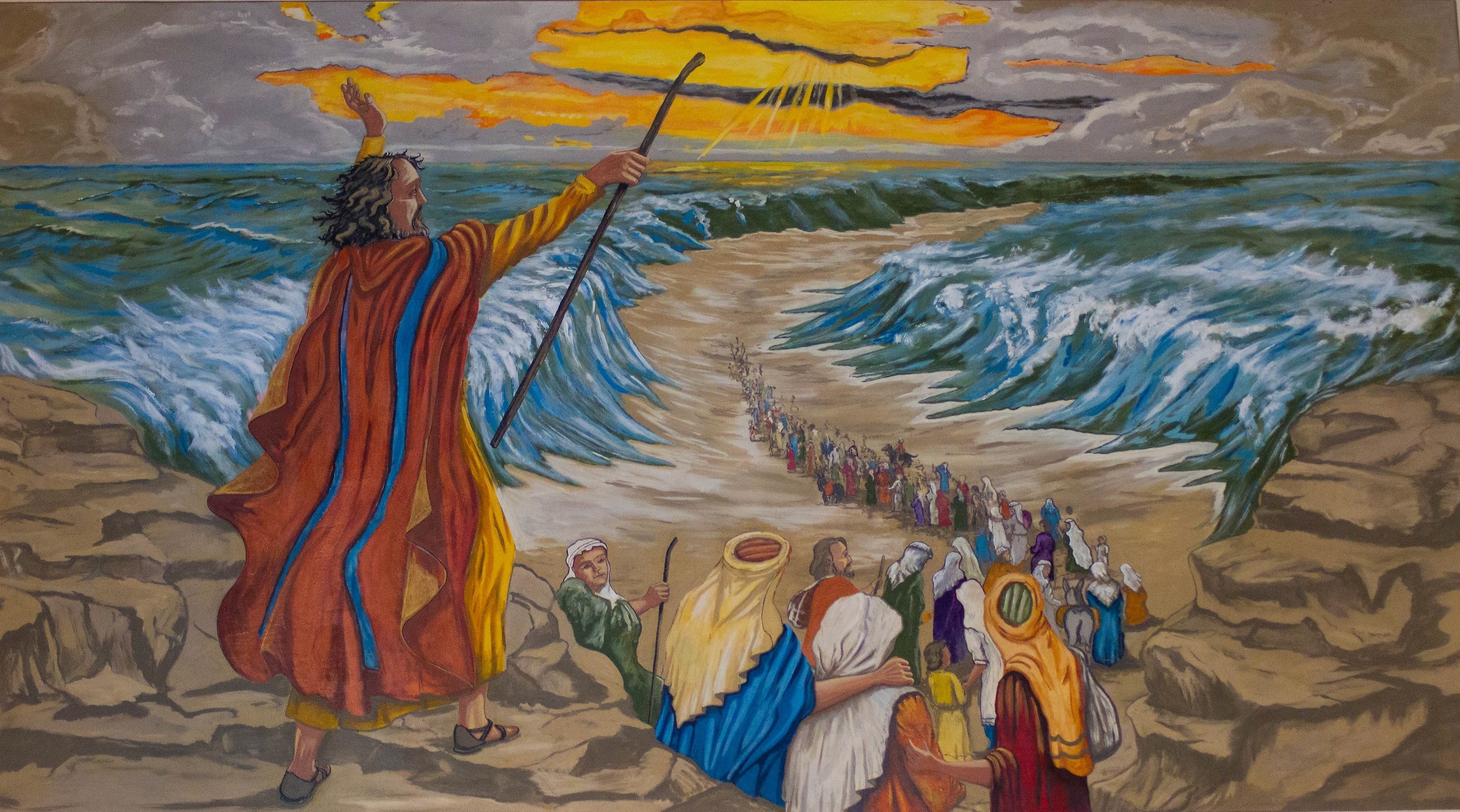 Moses opens the waters of the Red Sea