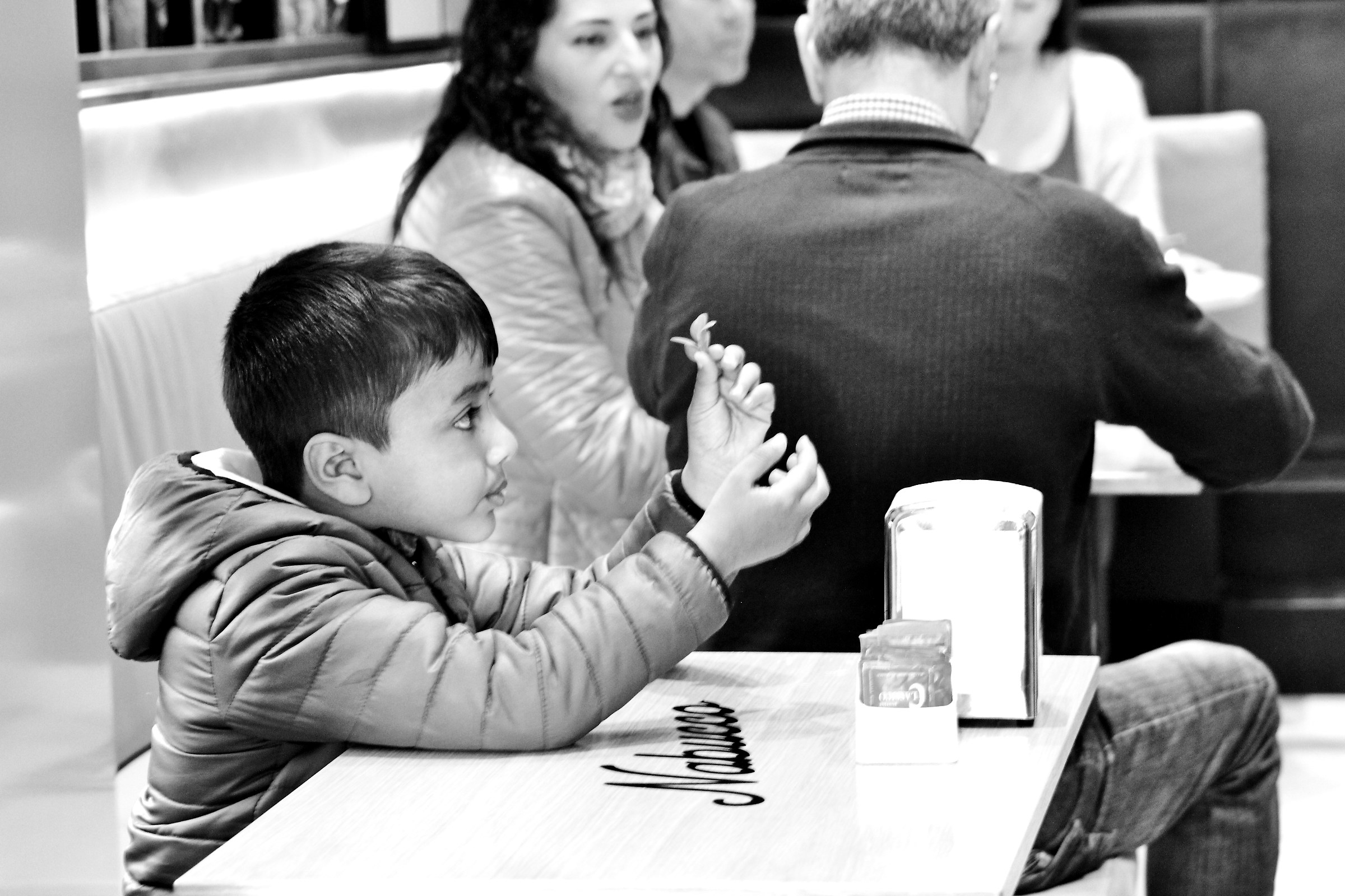 At the bar there are those who eat and talk and someone play...