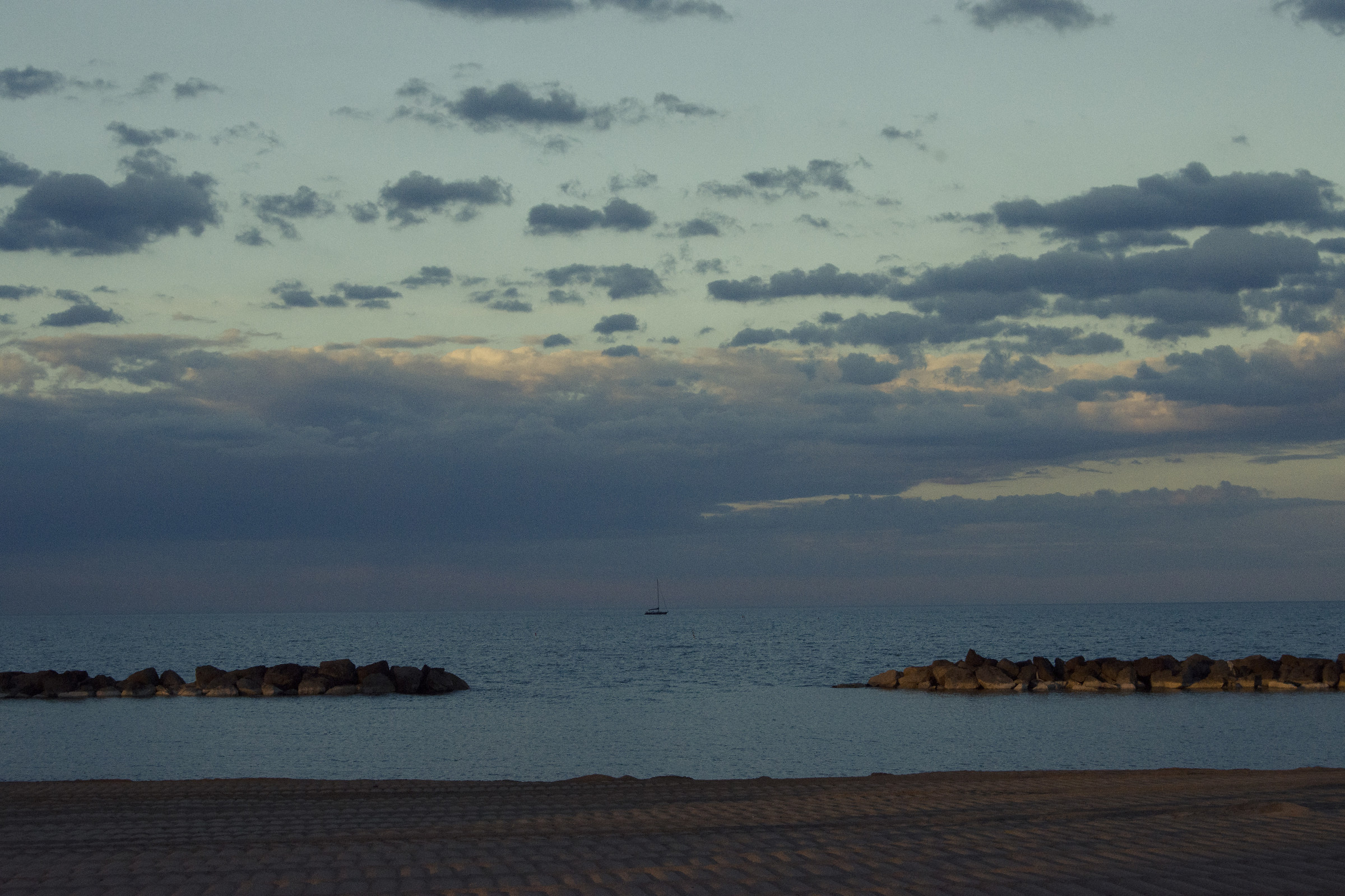 A lone boat on the horizon after the storm