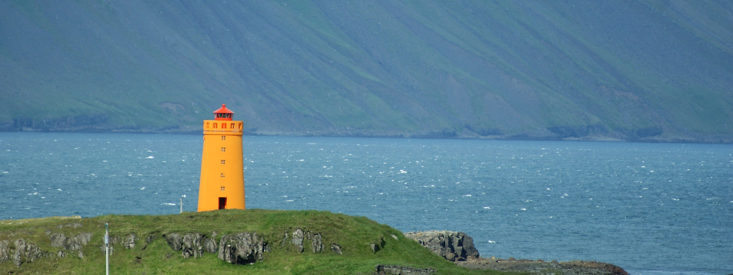 Lighthouse along a fjord