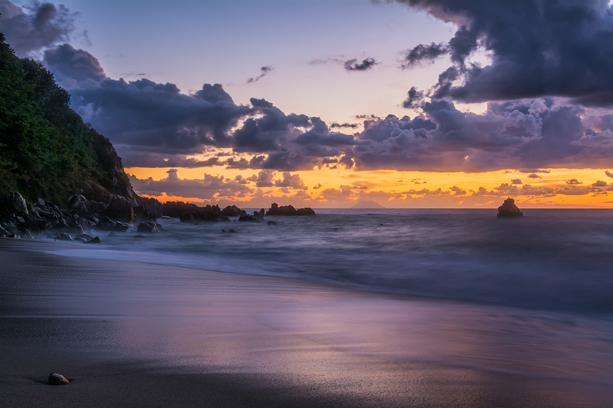 On the shore of a sunset