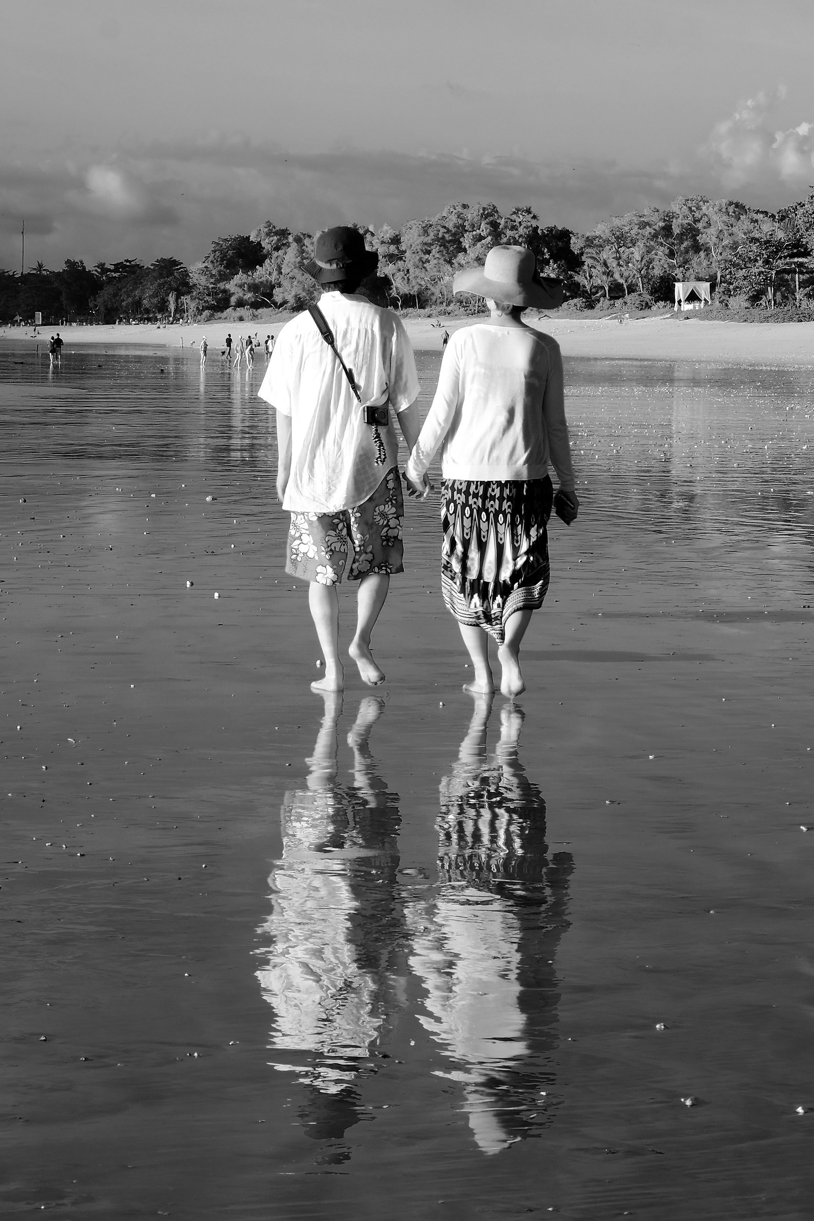 Jimbaran beach couple reflections
