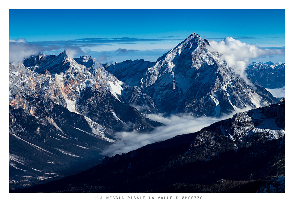 The antelao observes the fog rising up the valley of Ampezzo
