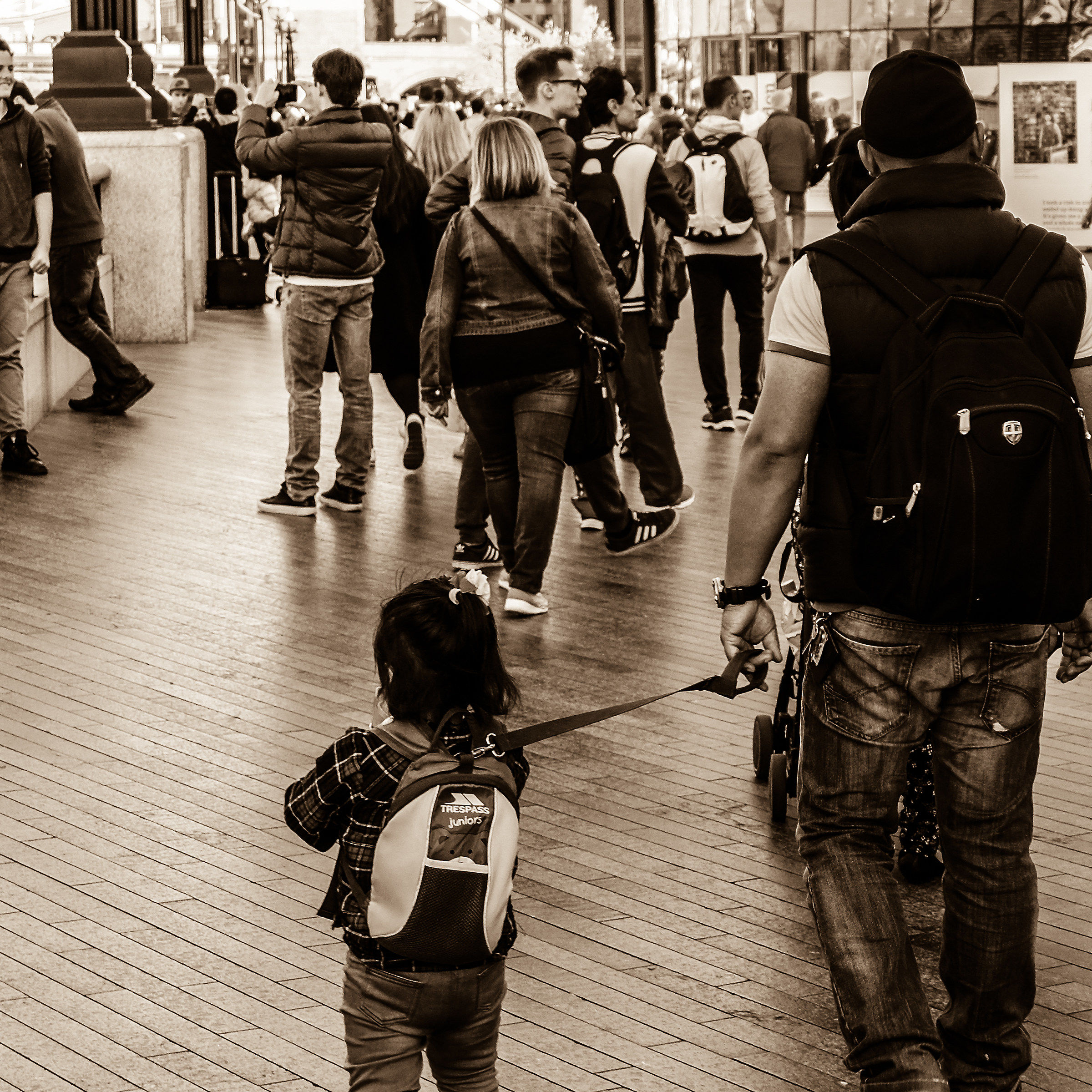 Little girl on leash
