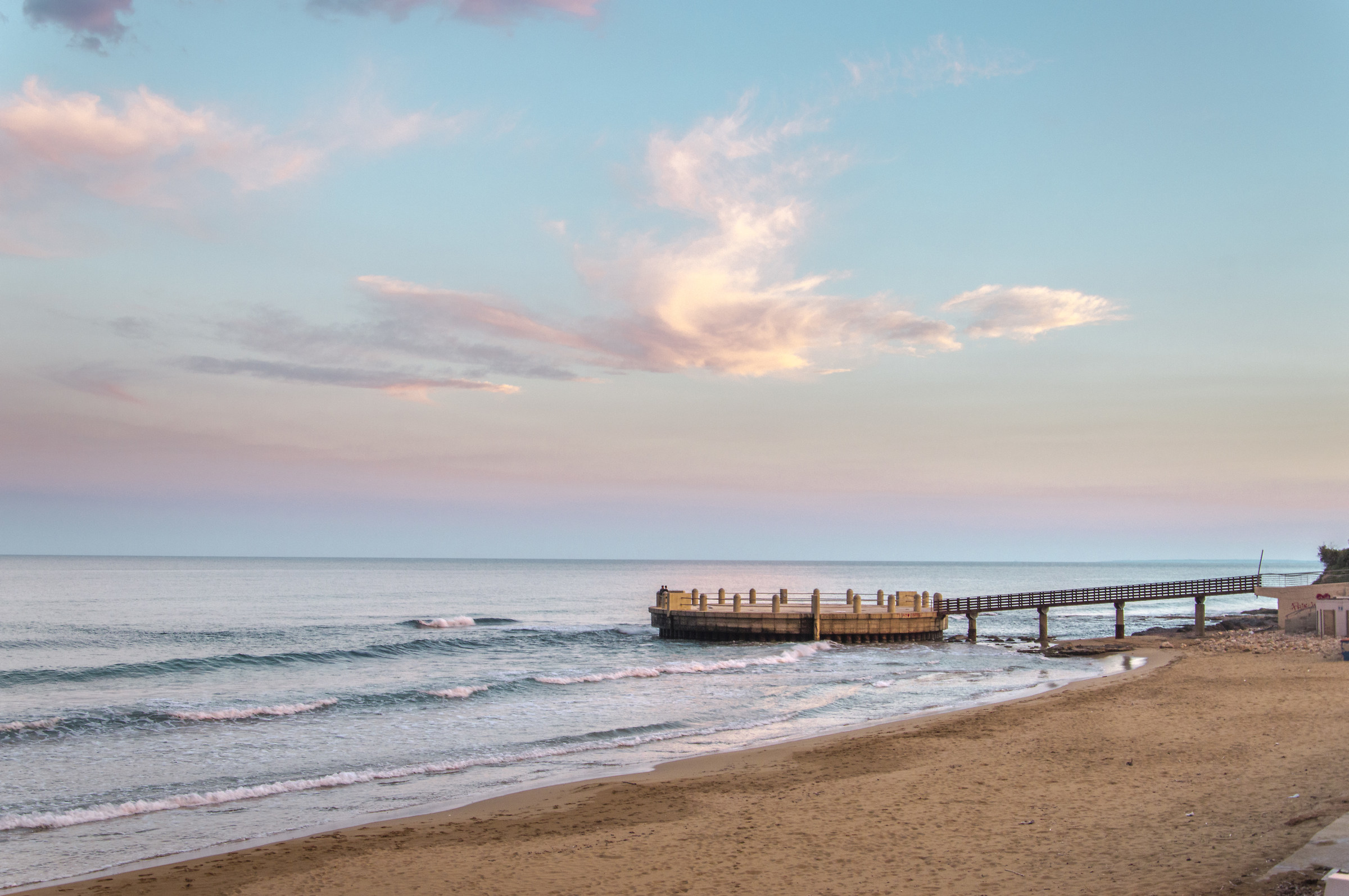 Shy clouds overlook the sea