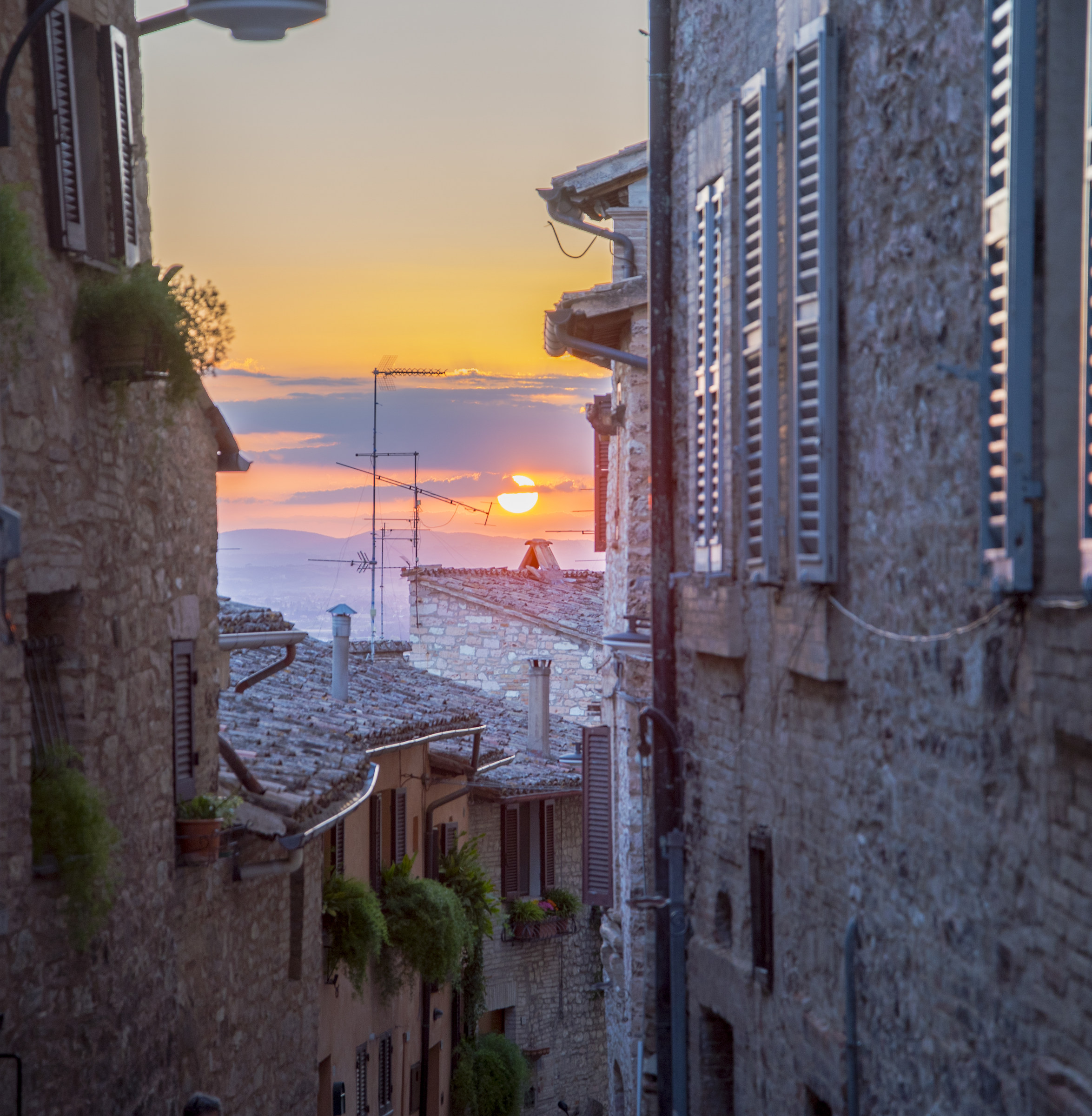 Sunset between the roofs of Spello
