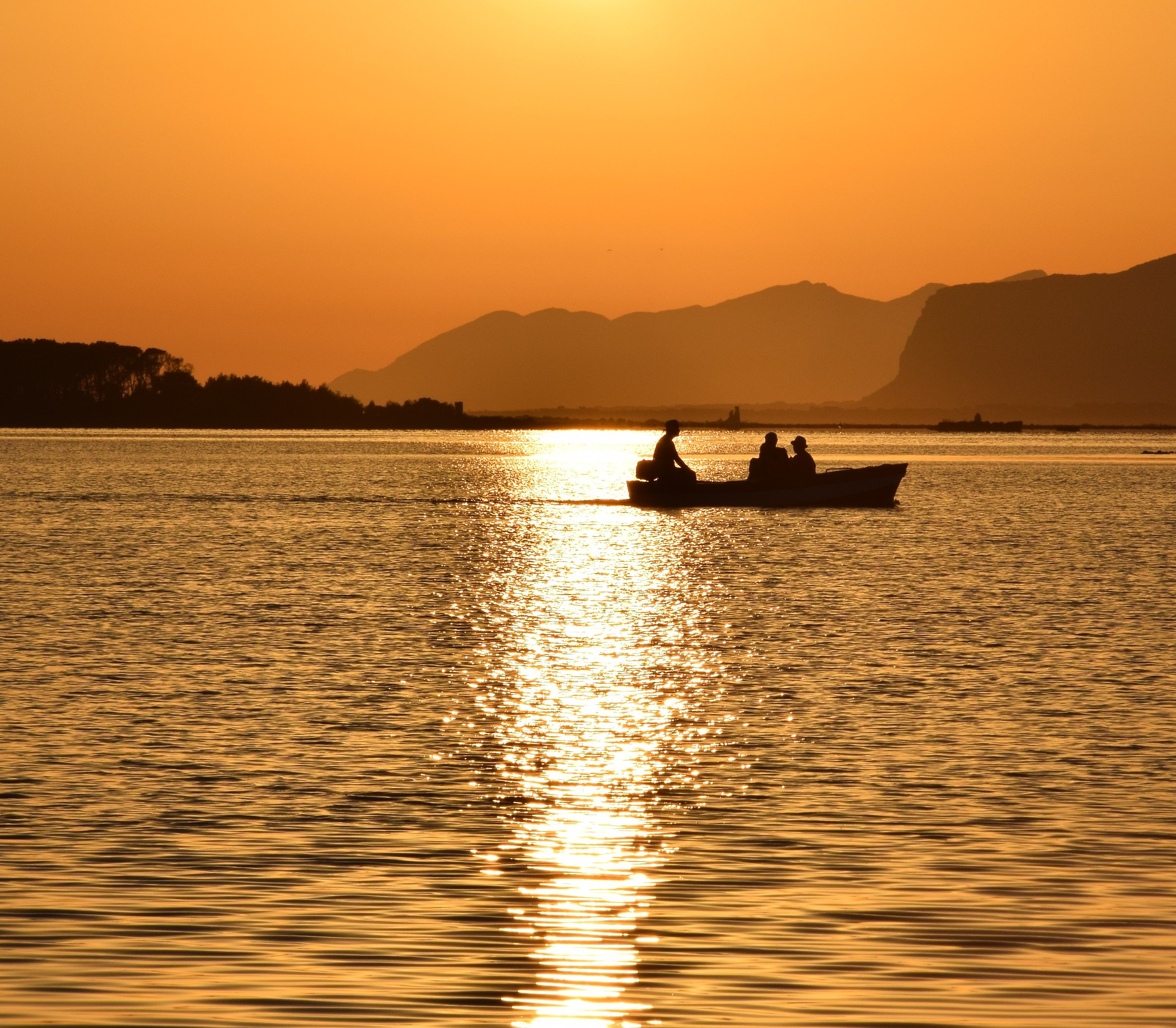 Boat at sunset of the Stagnone of Marsala
