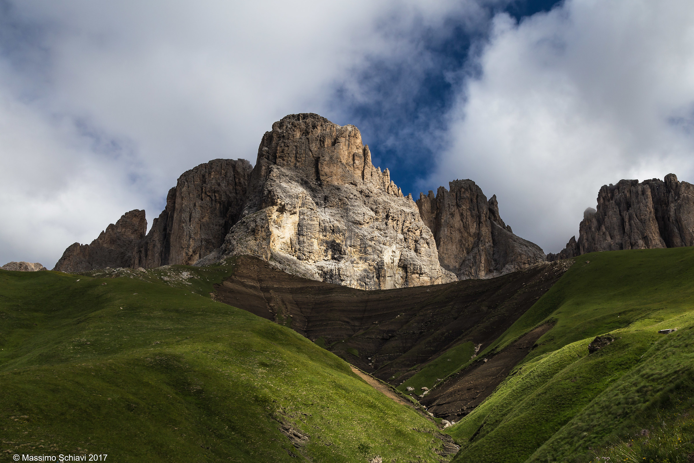 Between lights and shadows: towers of the Sassolungo.