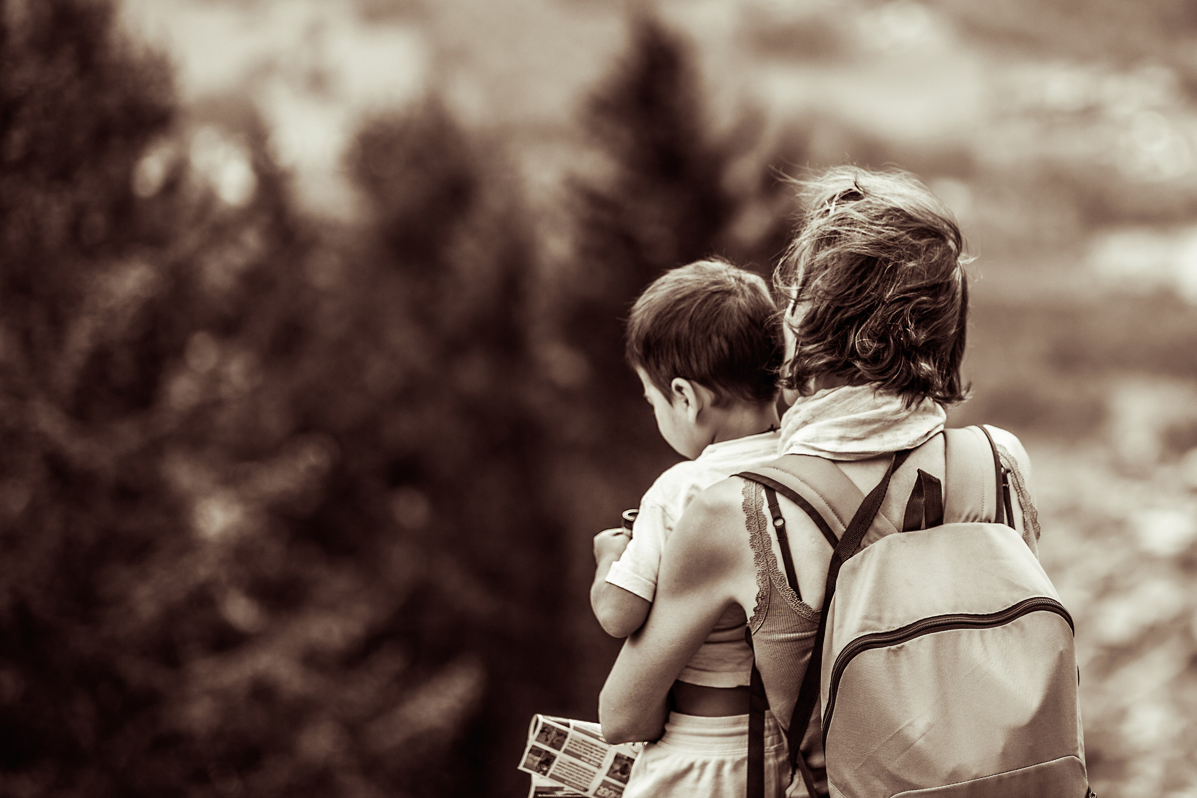 Between the mother's arms