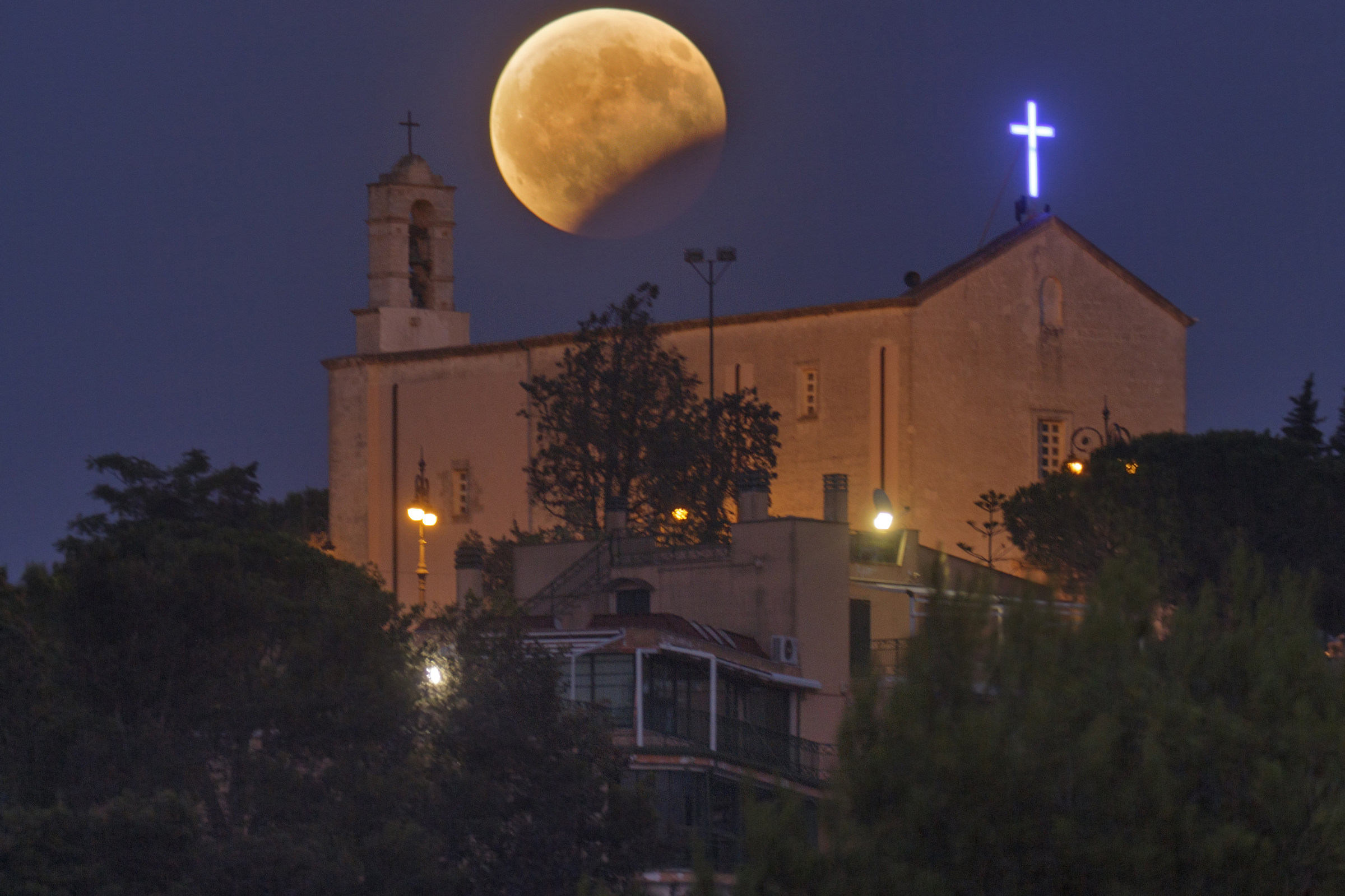 Moon eclipse above the church of Casarano