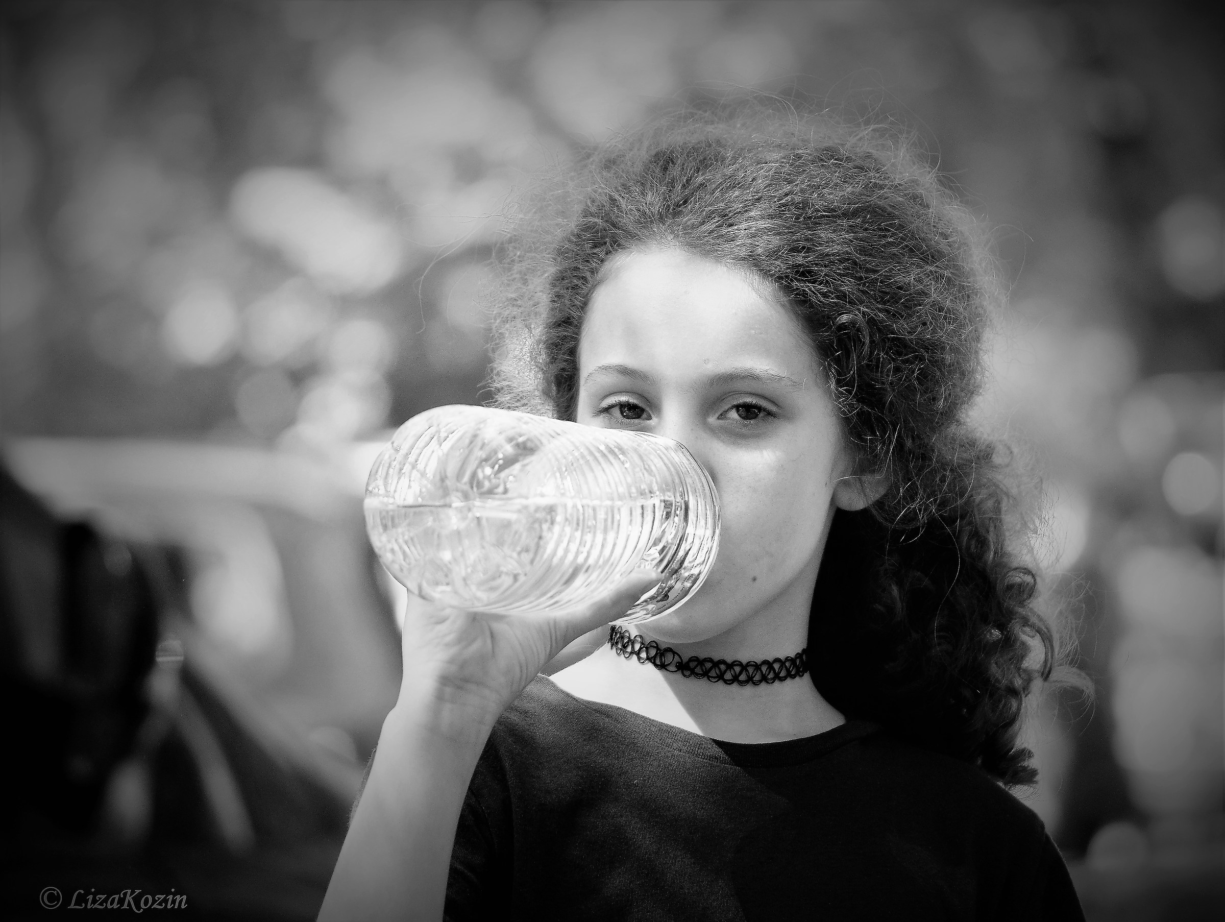 Little girl with bottle of water
