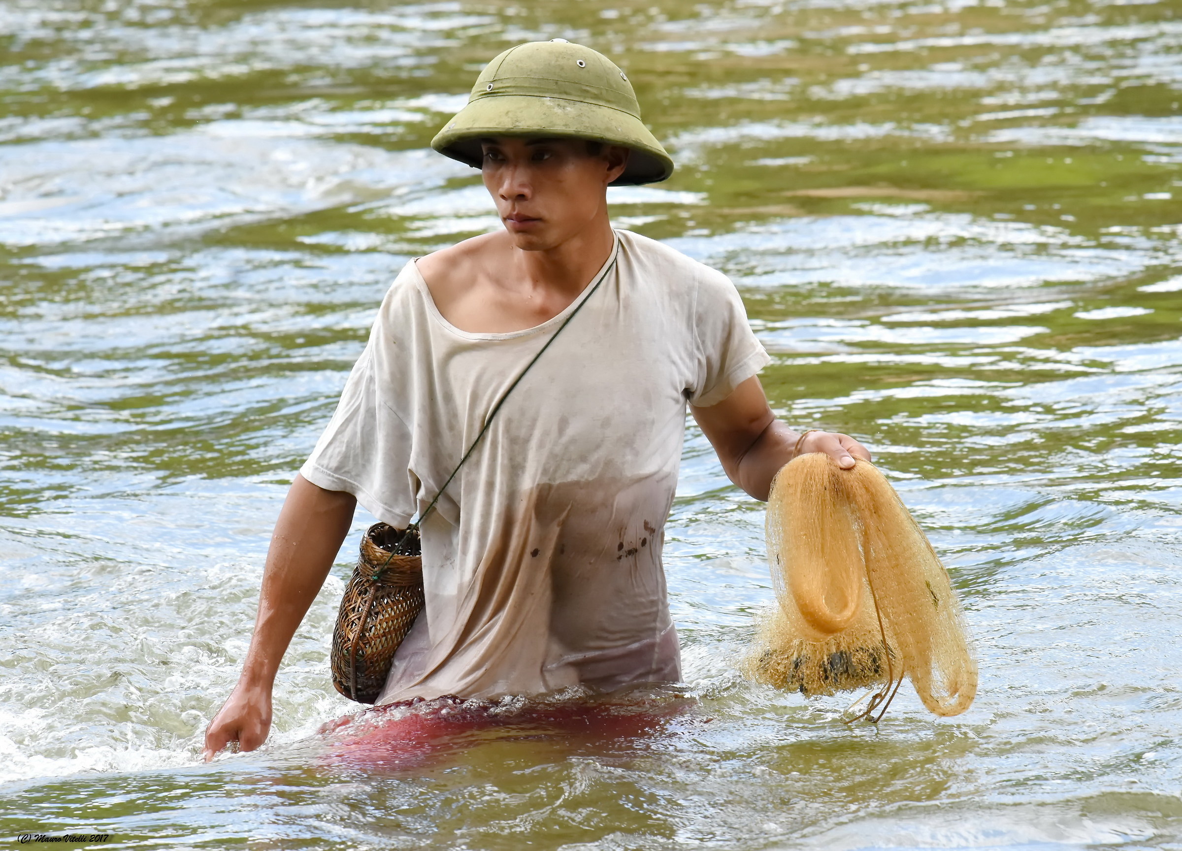 Fisherman in the torrent (Vietnam)