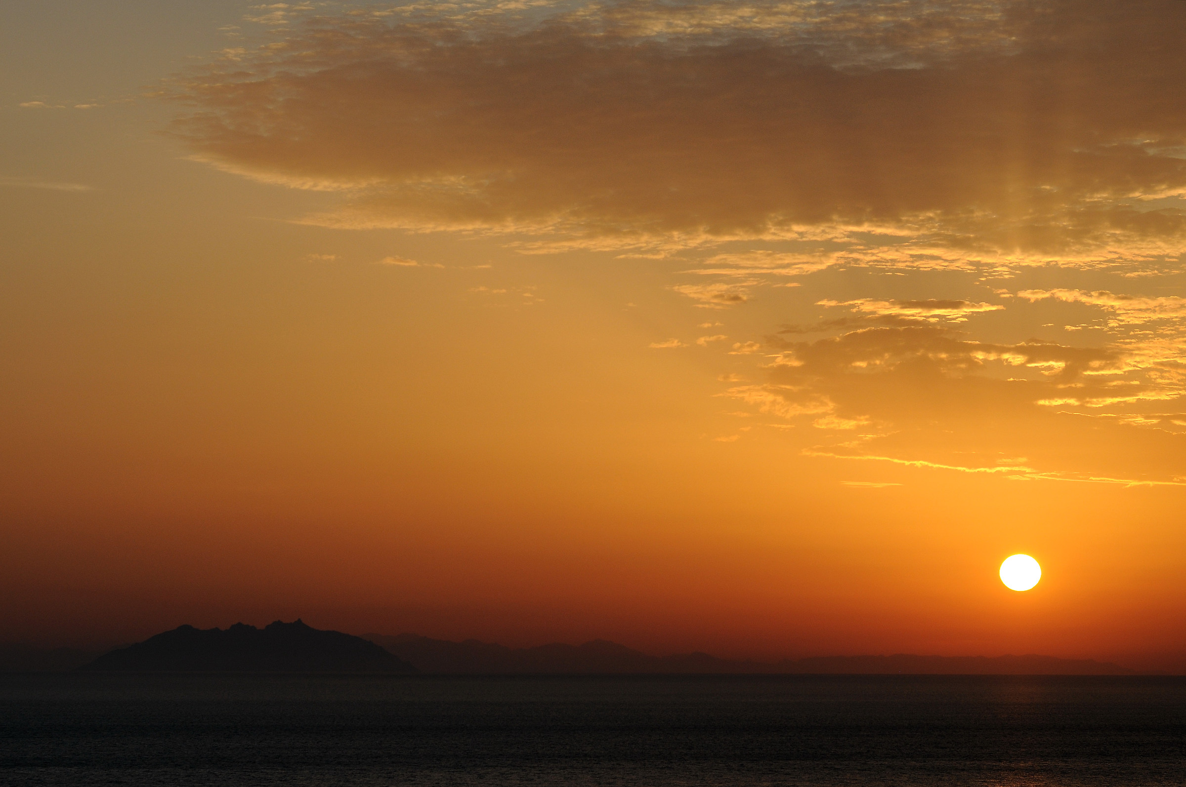 Sunset with the island of Montecristo