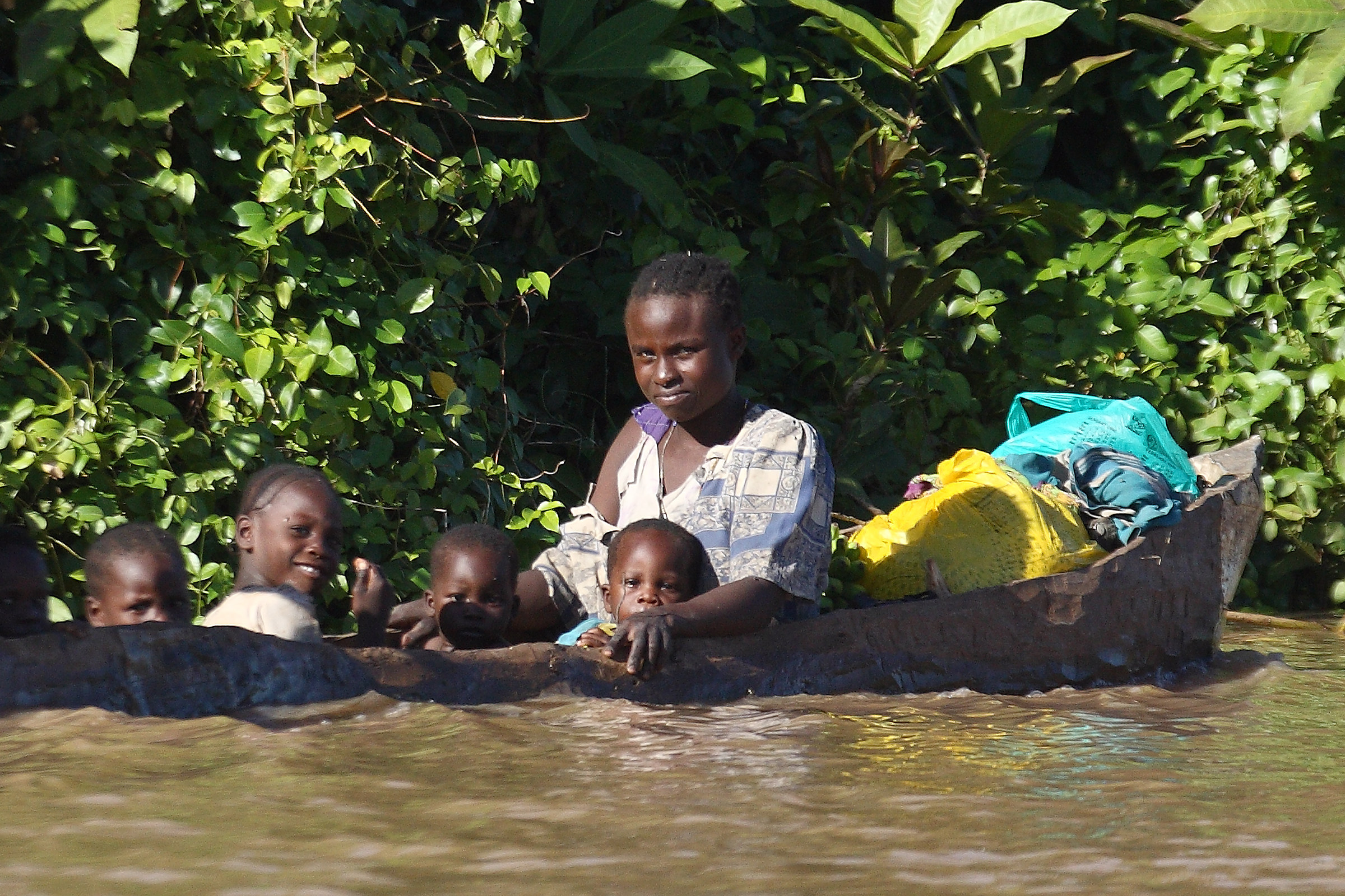 The cheerful family on the river